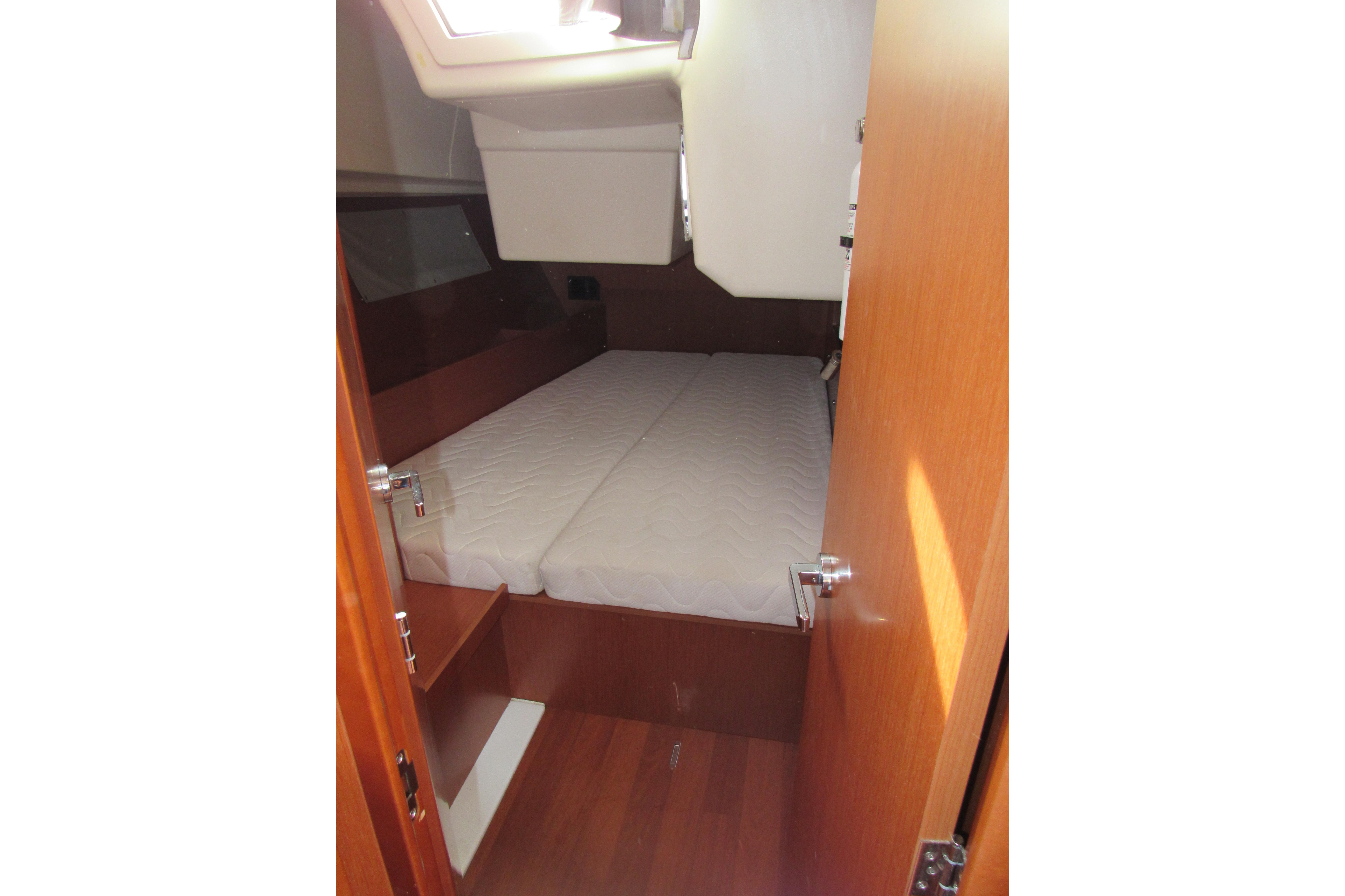 2017 Beneteau Oceanis 41.1 cabin interior with bed and wooden finish.