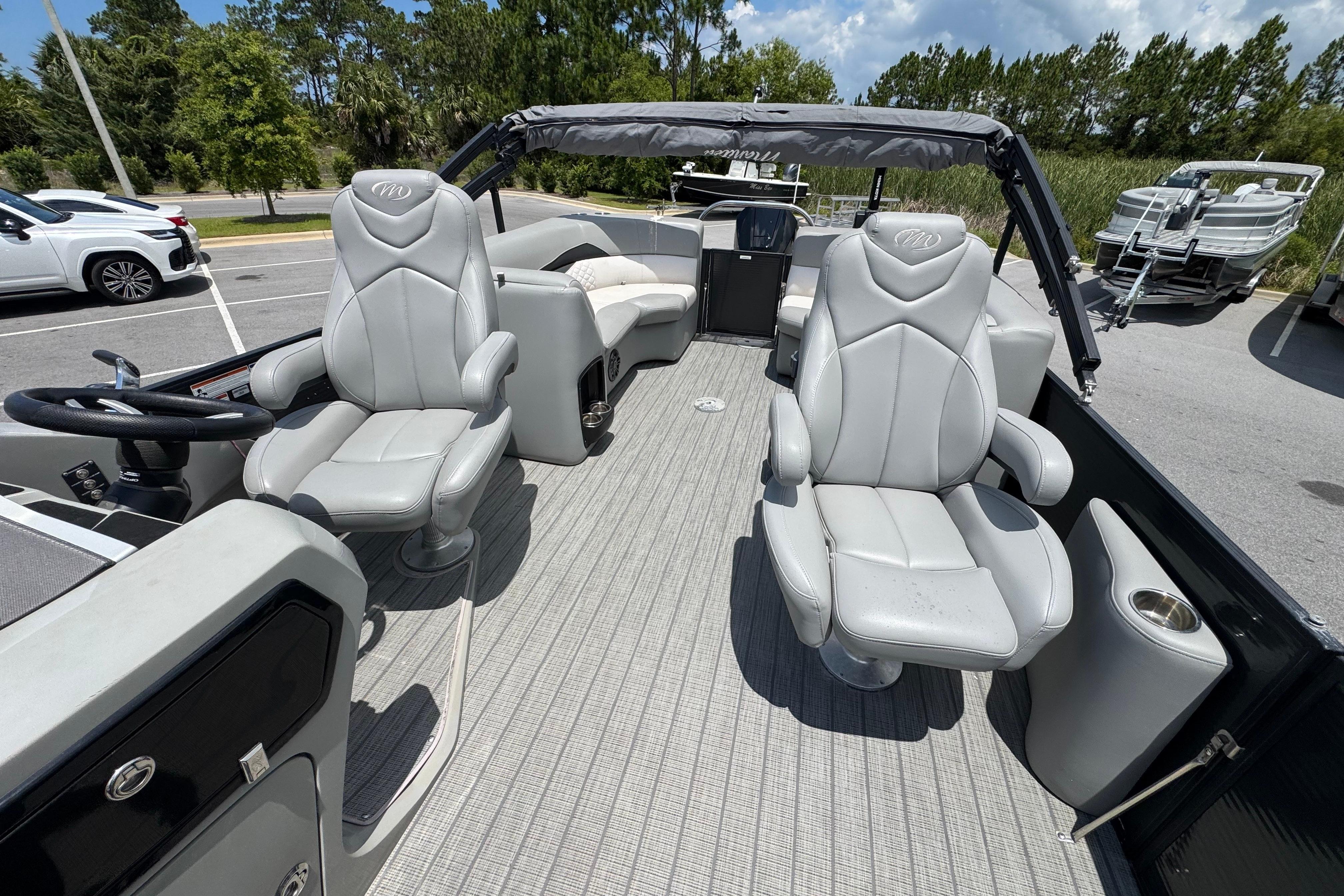 2022 Manitou 25 Encore pontoon boat interior with plush seating and modern design.