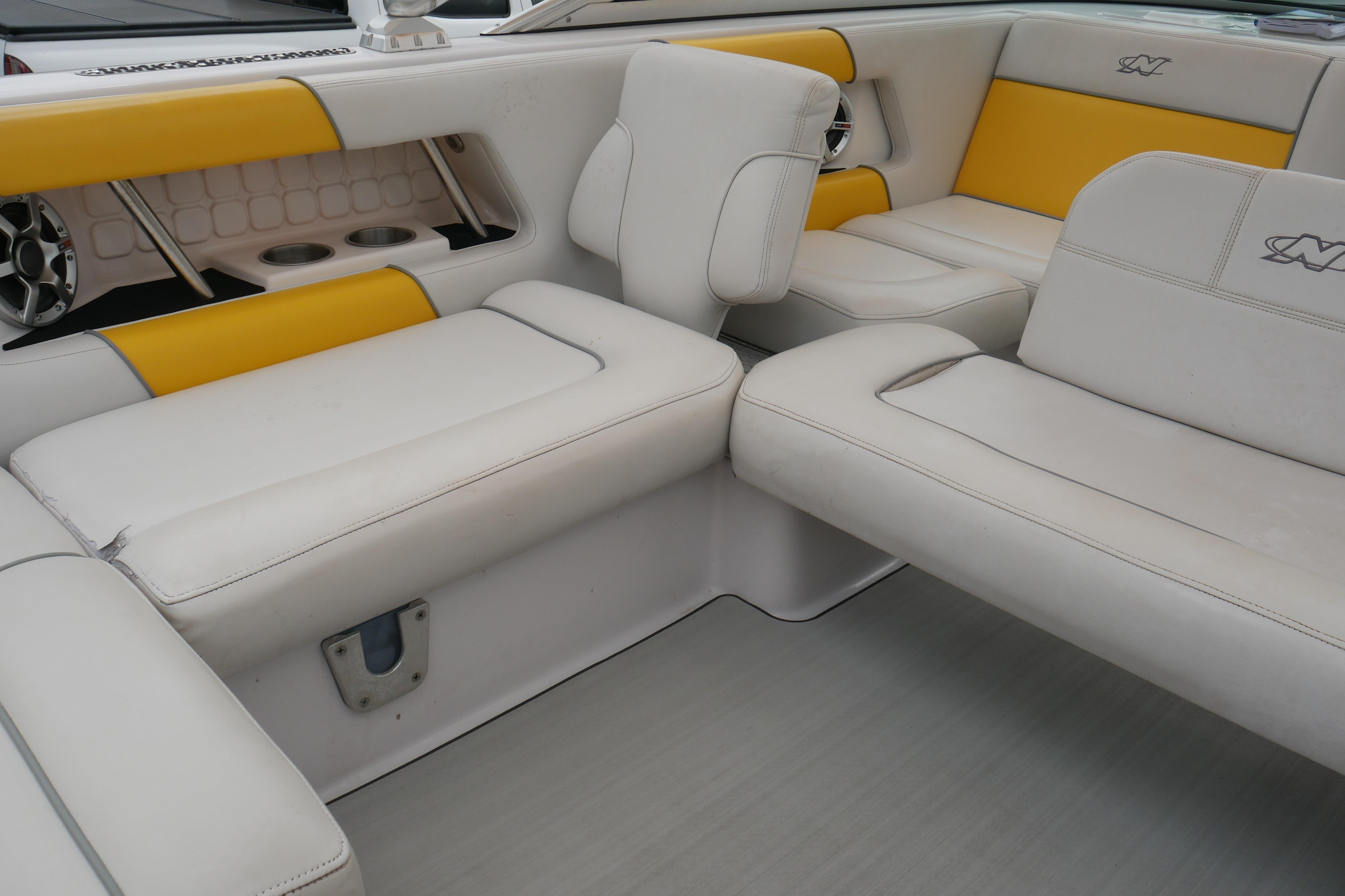 2007 Correct Craft 236 Team Edition boat interior with white and yellow seating.