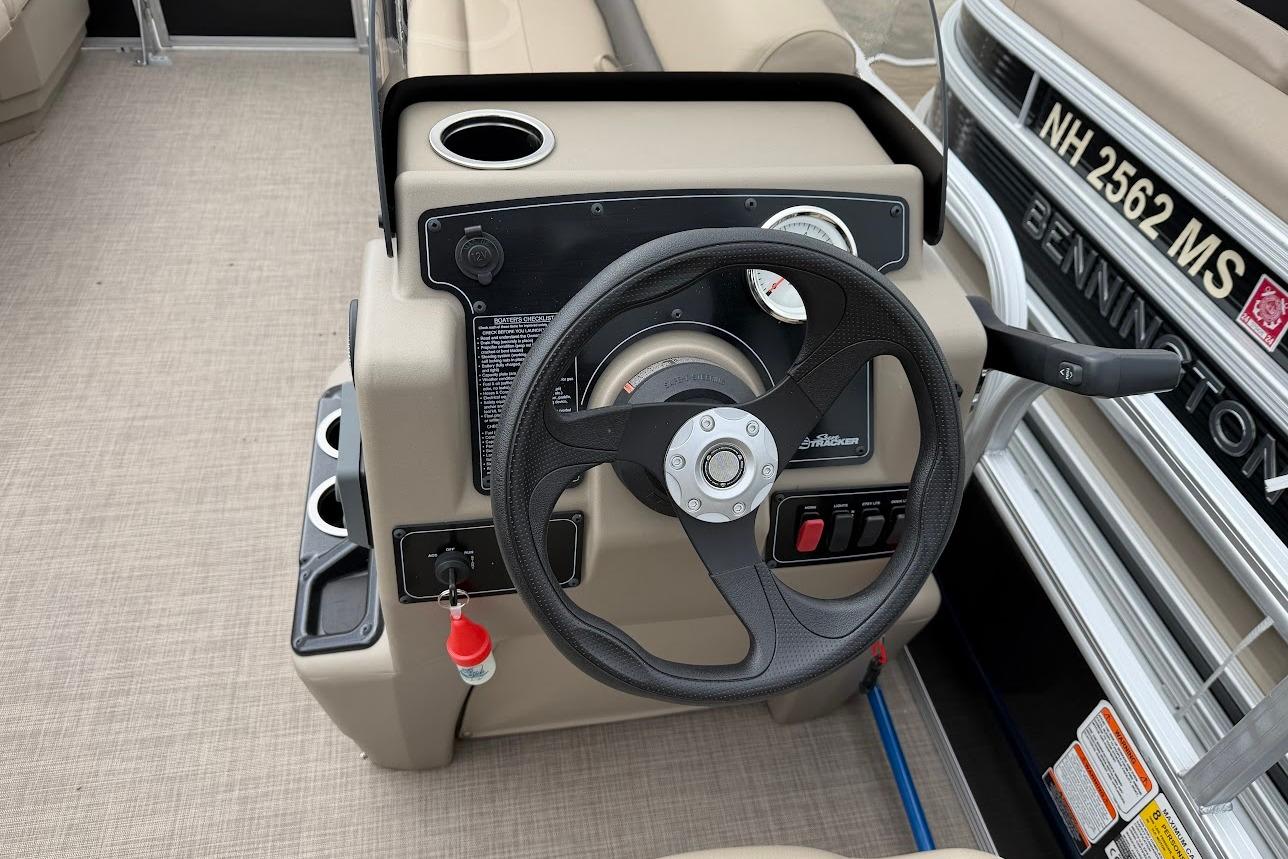 Steering console of 2025 Sun Tracker Party Barge 16 DLX pontoon boat.