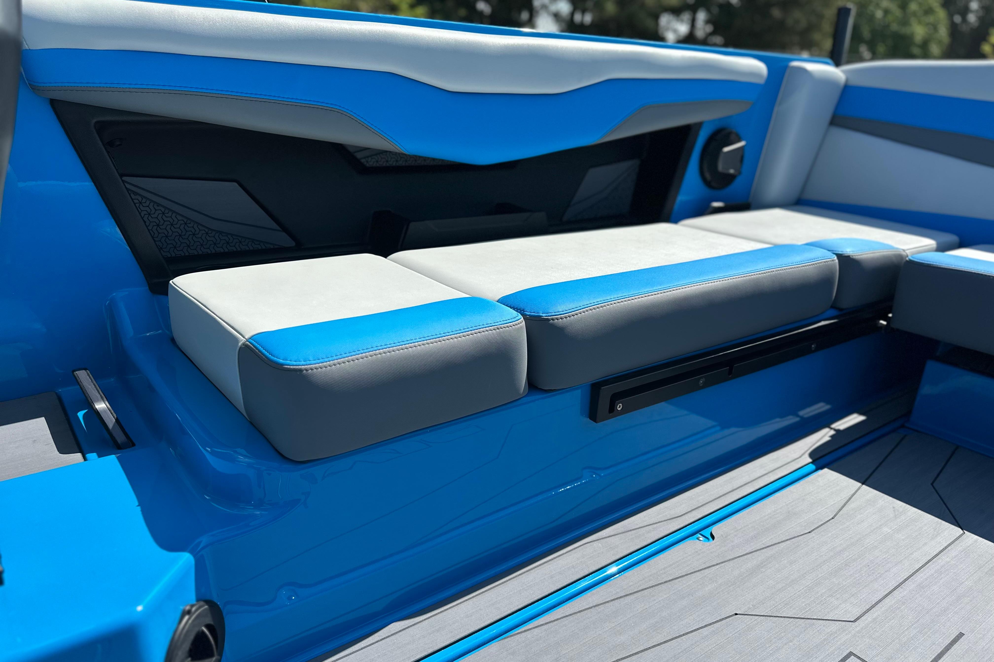 2026 Axis T235 boat interior with blue and gray seating, modern design.