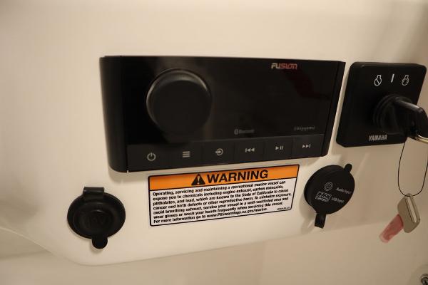 Control panel of 2025 Sea Fox 228 Traveler boat with warning label.