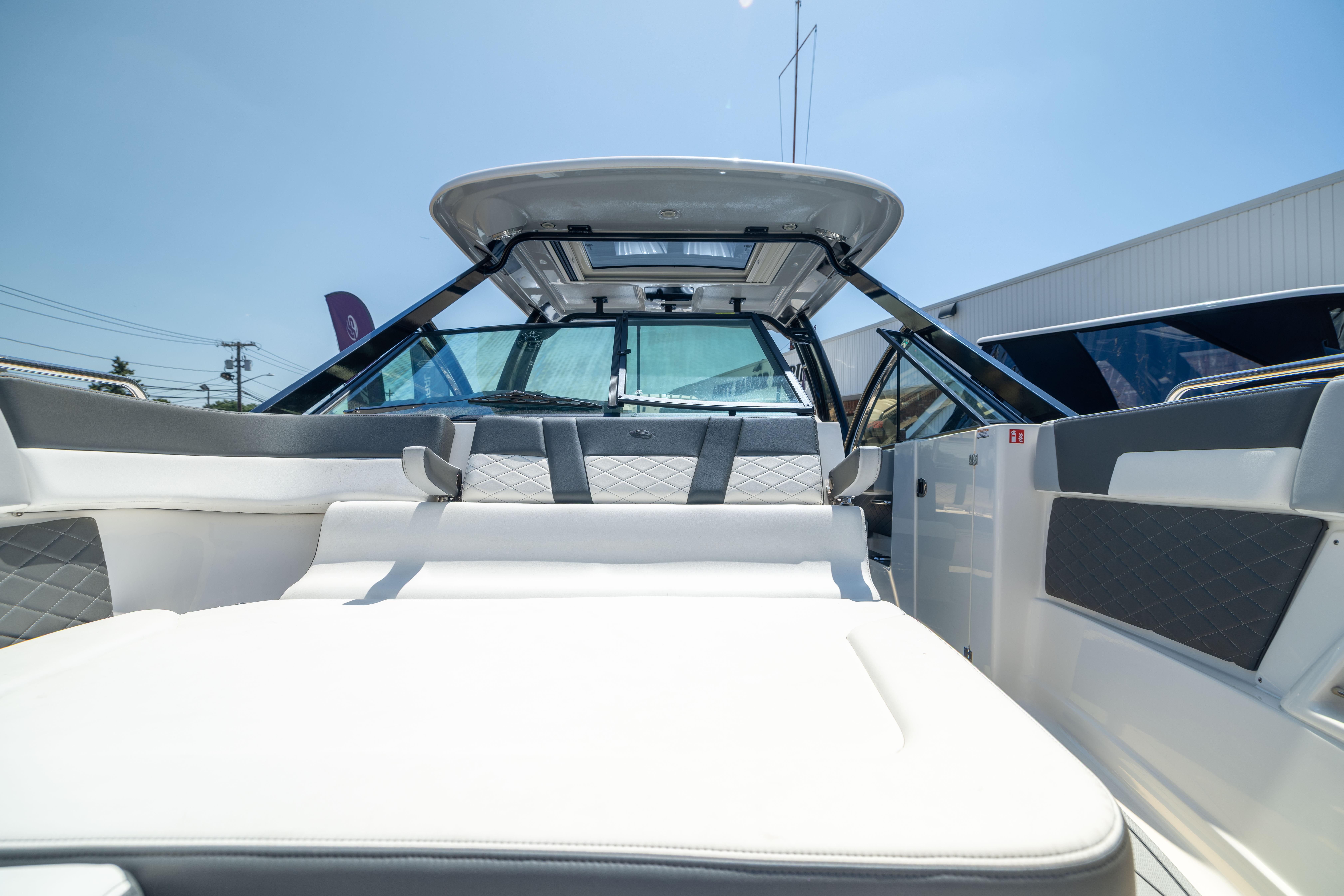 2026 Chaparral 310 OSX boat interior with luxurious seating and modern design.