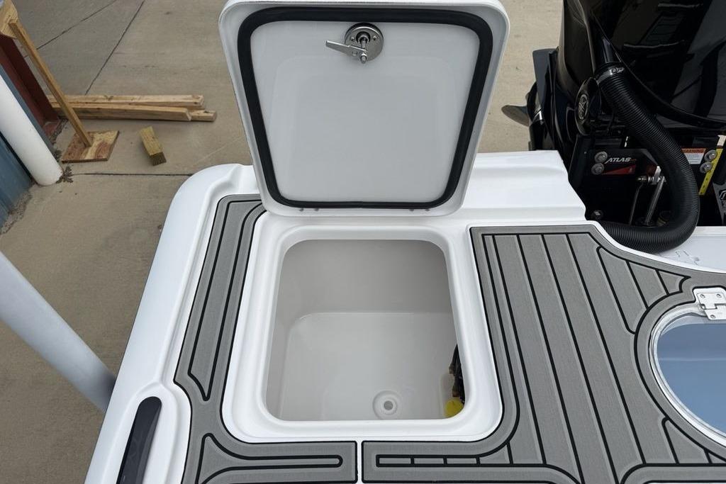 Open storage compartment on 2026 Tidewater 2500 Carolina Bay boat deck.