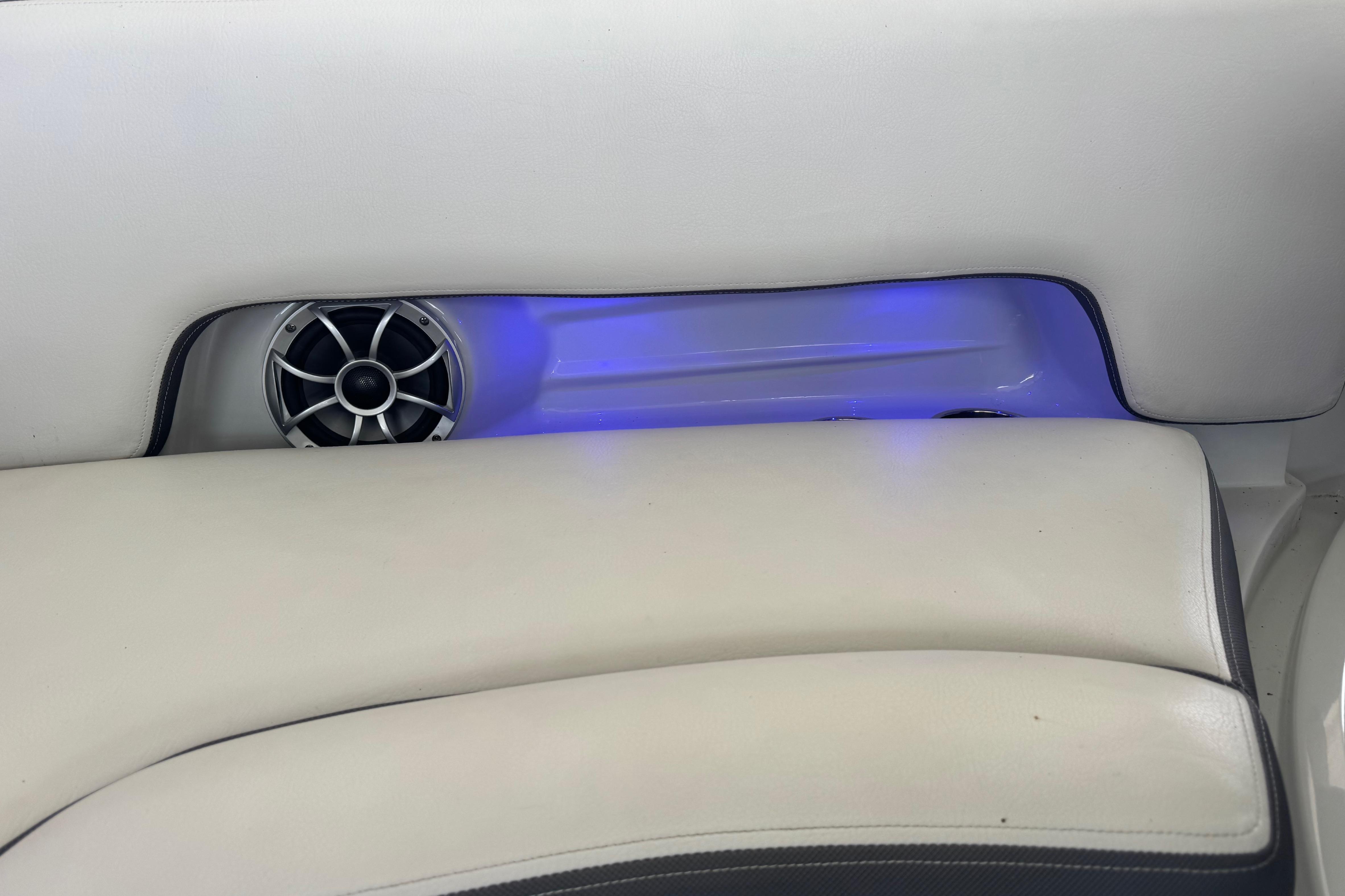 2022 Crownline 265 SS boat interior with speaker and blue LED lighting.