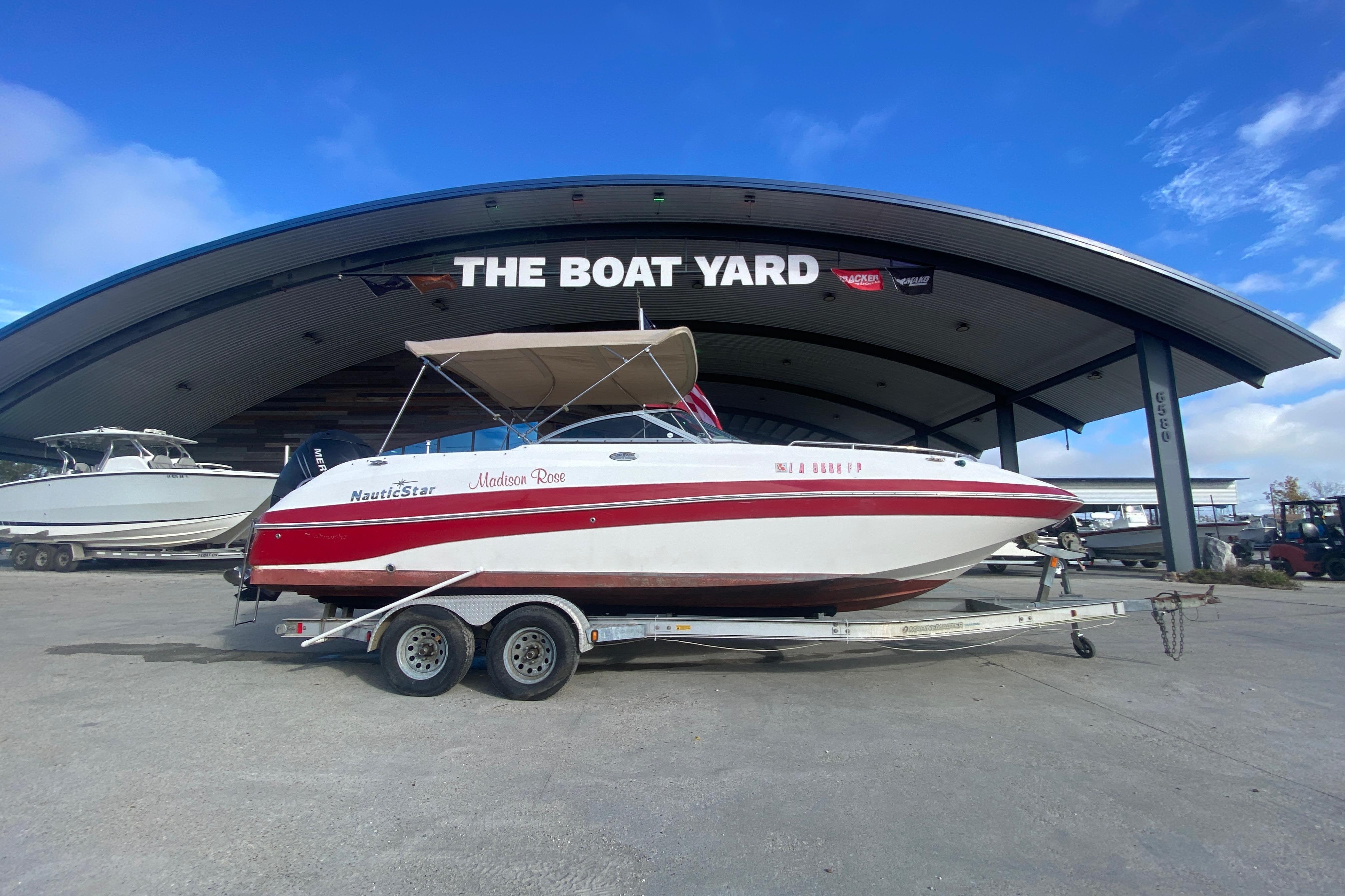 2007 NauticStar 230DC Sport Deck boat on trailer at The Boat Yard.