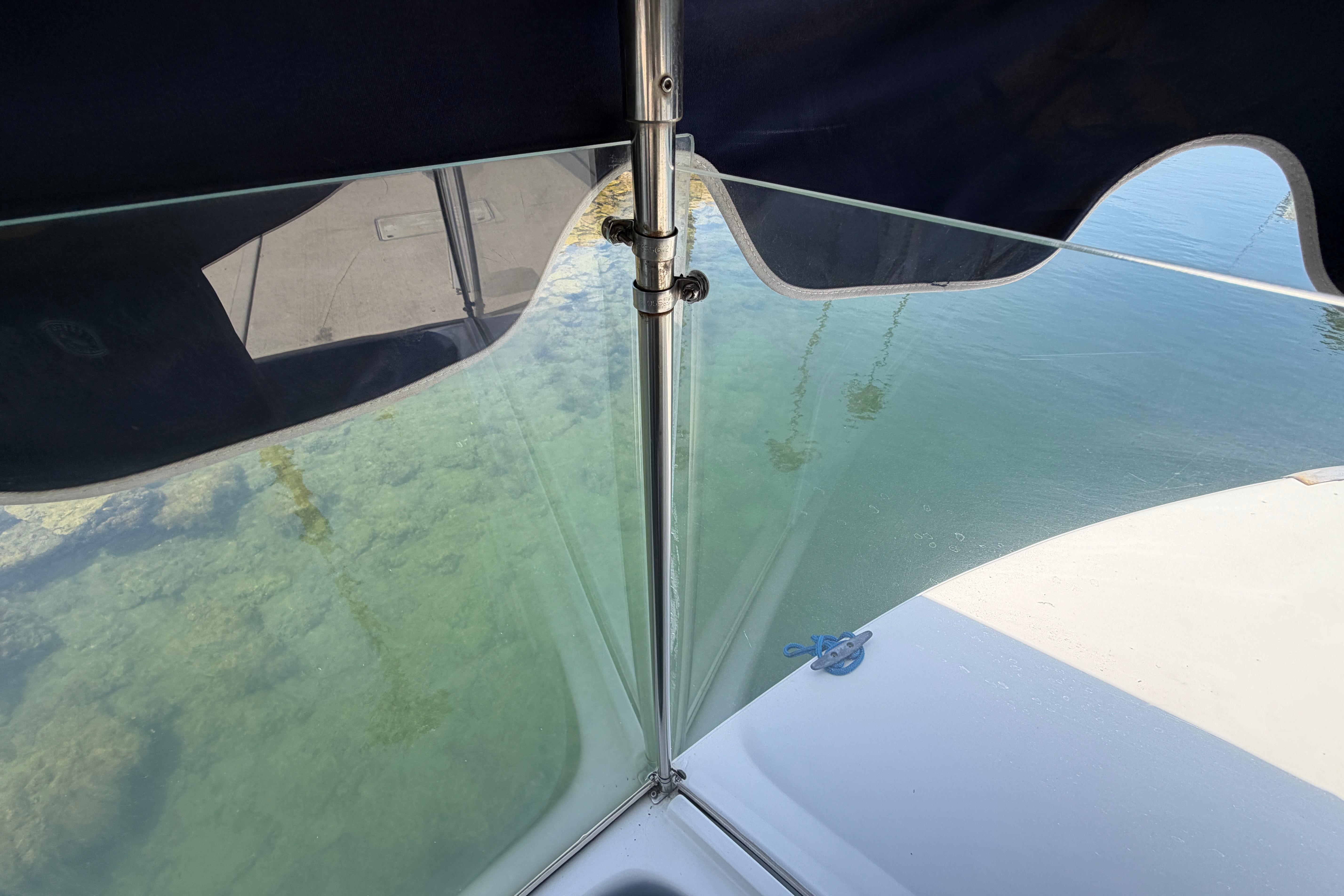 View from a 1996 Duffy Classic 21 boat, showing clear water and canopy.