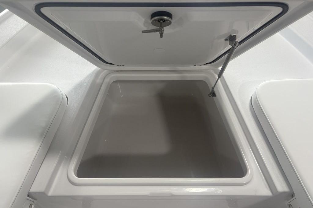 Open storage compartment in 2026 Sportsman Masters 227 boat.