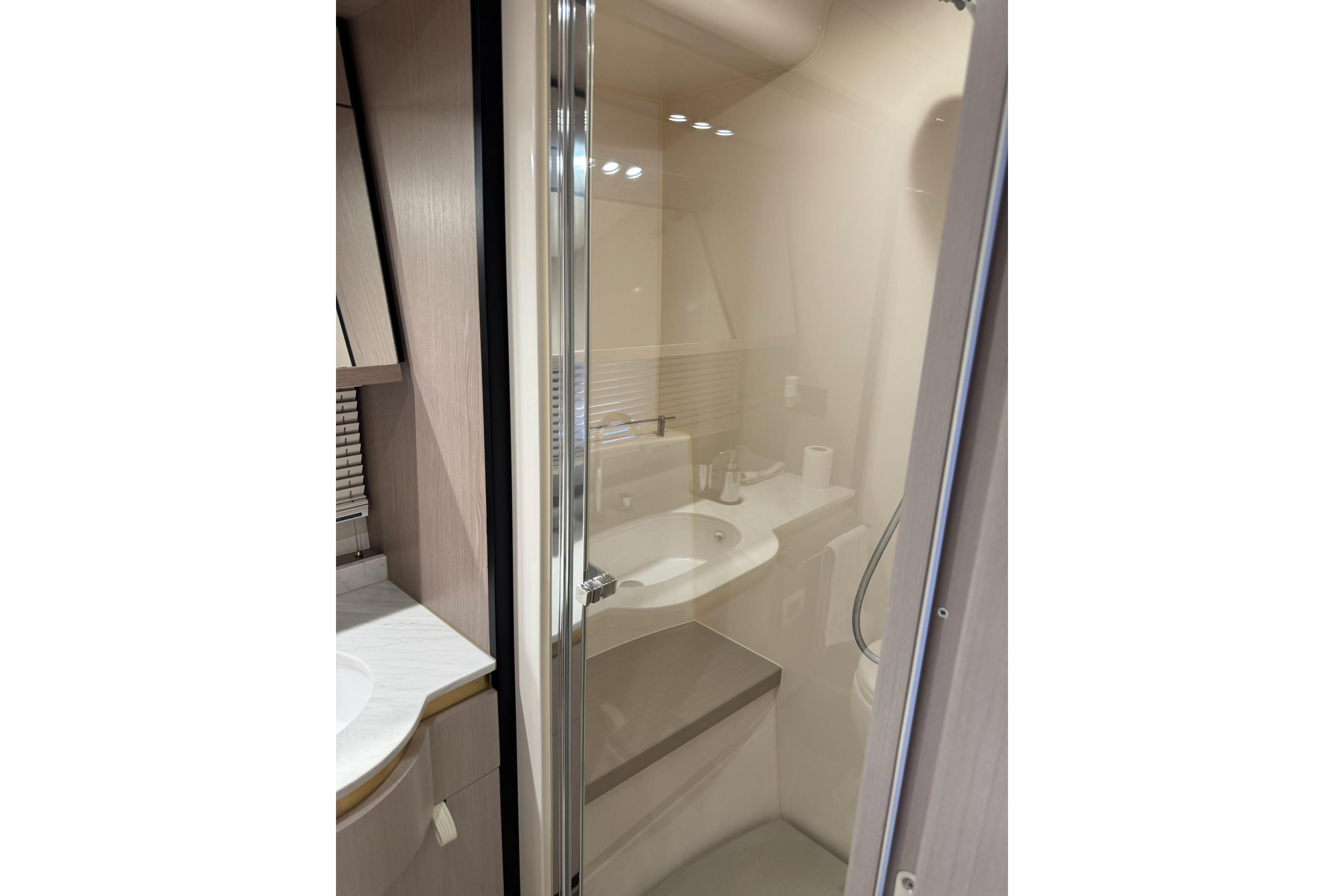 Modern bathroom interior on 2021 Azimut 55 yacht, featuring sleek design and elegant fixtures.