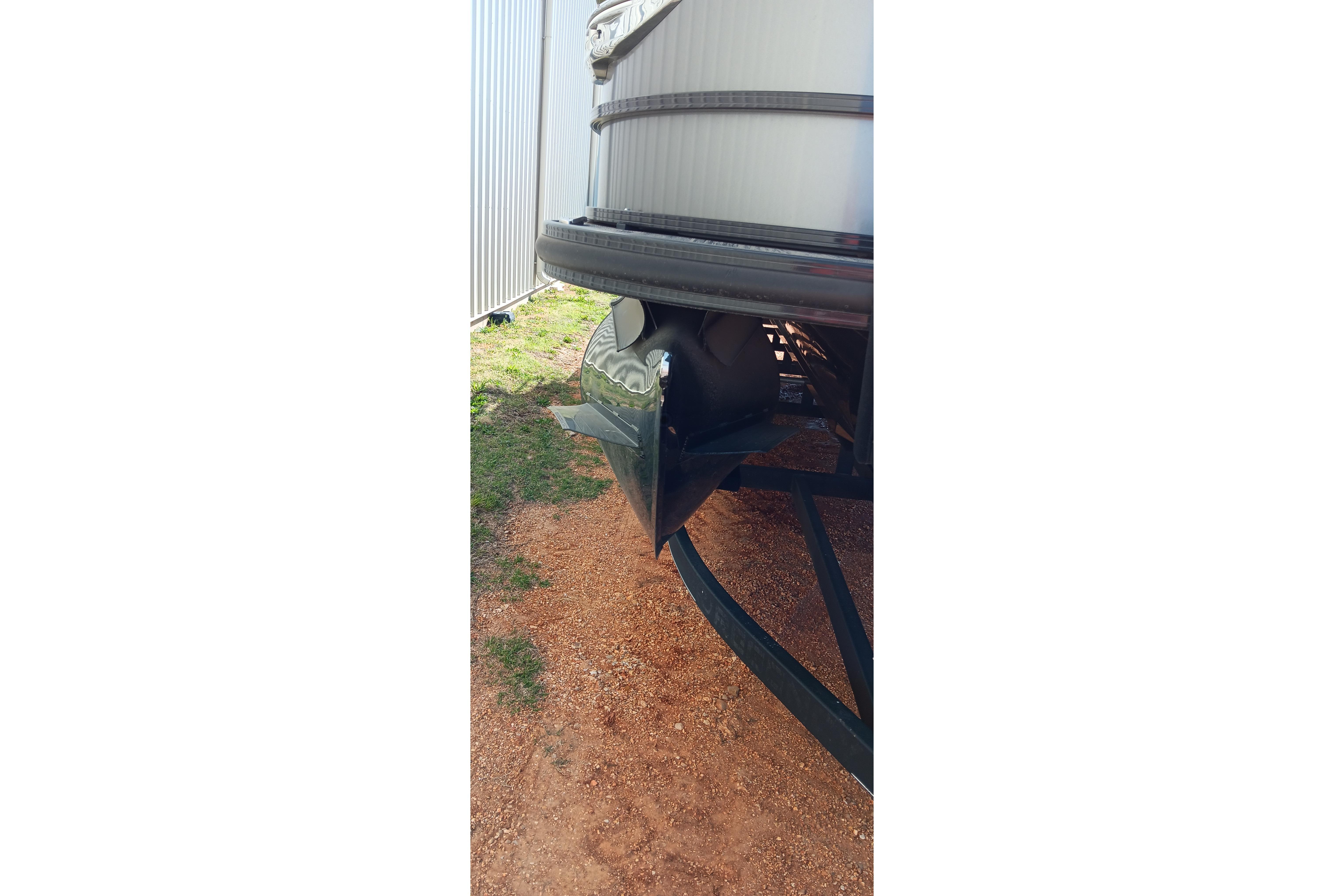 2023 Ranger 2500LS boat trailer hitch on gravel near metal building.