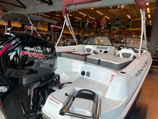 2023 Tahoe 185 S boat with Mercury Pro XS engine displayed in showroom.