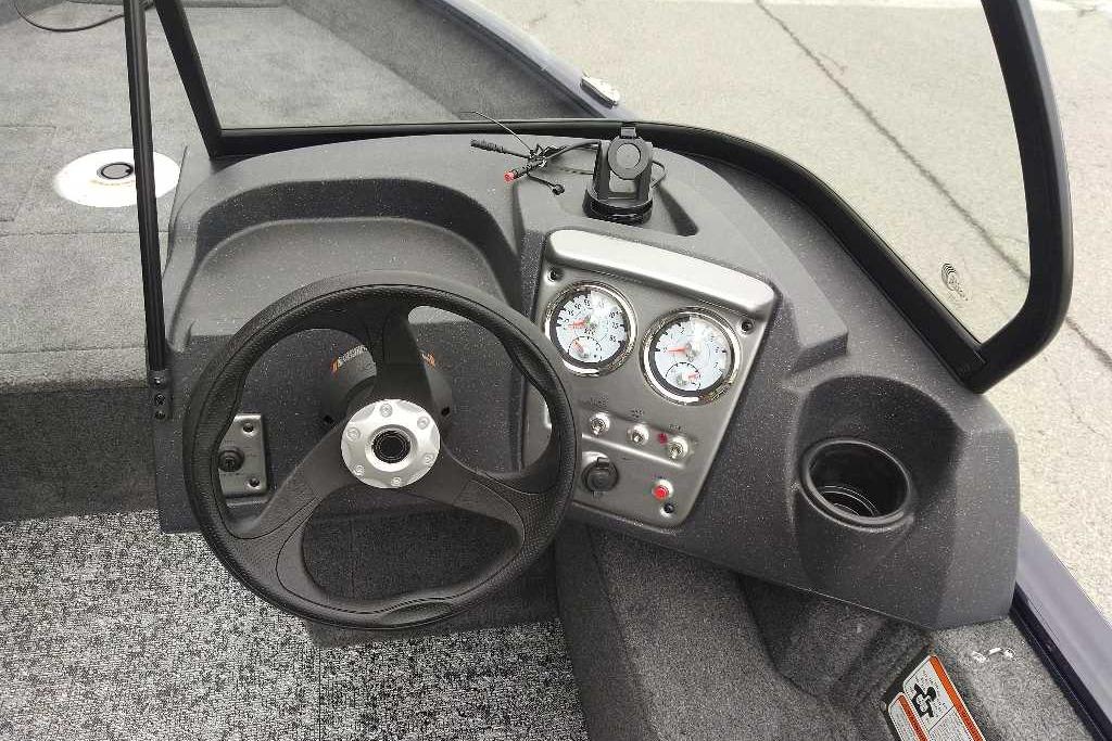 Steering console of 2026 Tracker Pro Guide V-16 WT boat with gauges and controls.