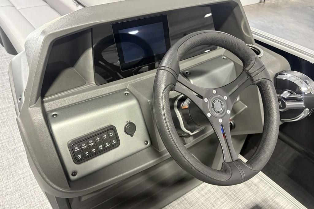 Steering console of 2026 Sun Tracker PARTY BARGE® 20 DLX with modern controls.