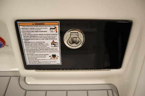 2025 Sea Fox 228 Commander boat warning label and latch detail.
