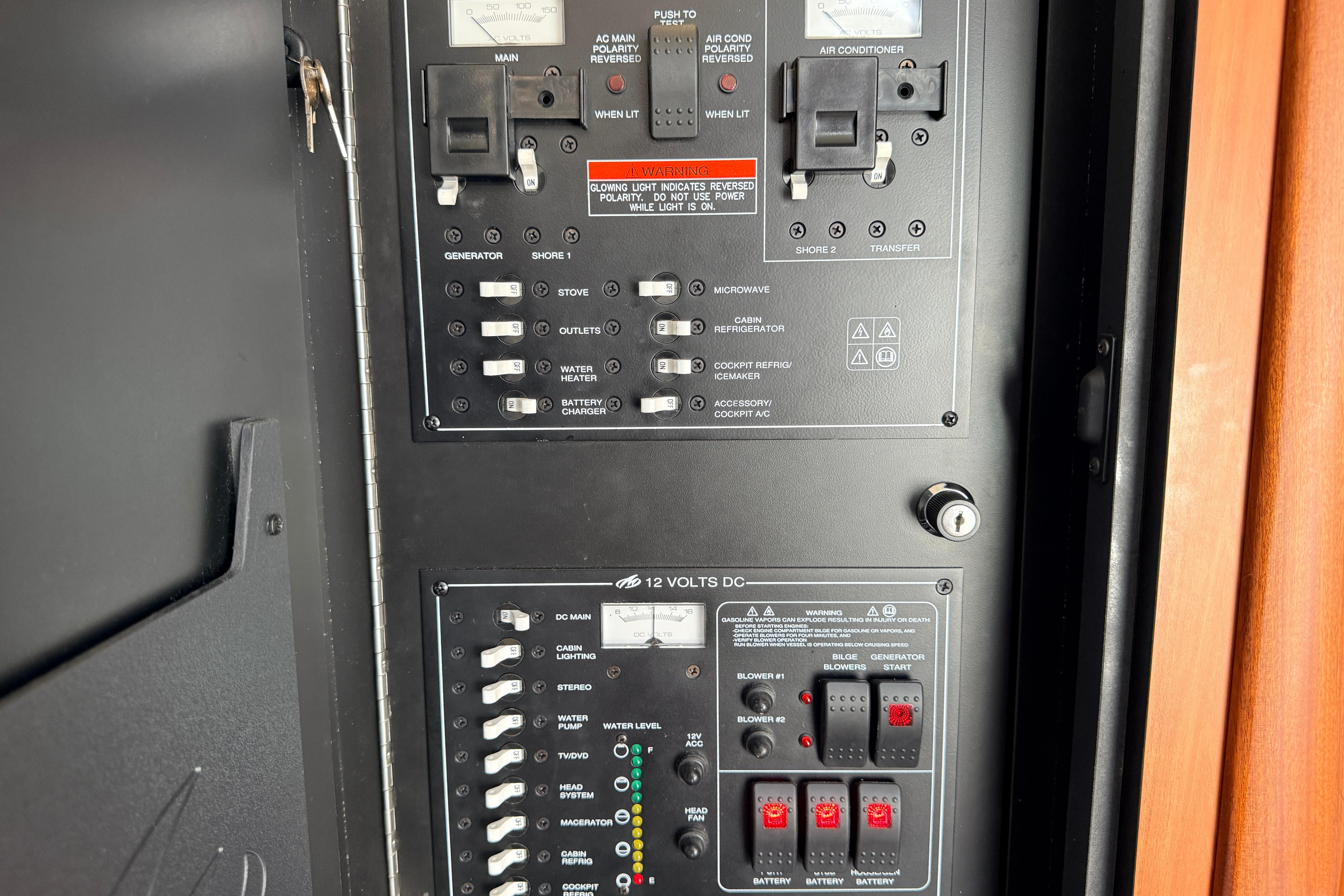 Electrical control panel of a 2011 Monterey 320 Sport Yacht, featuring switches and indicators.