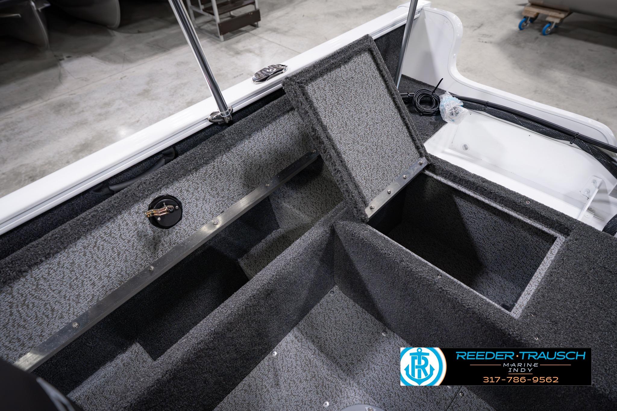 2026 Lund 1650 Rebel XL SS boat interior with open storage compartments, displayed at Reeder-Trausch Marine.