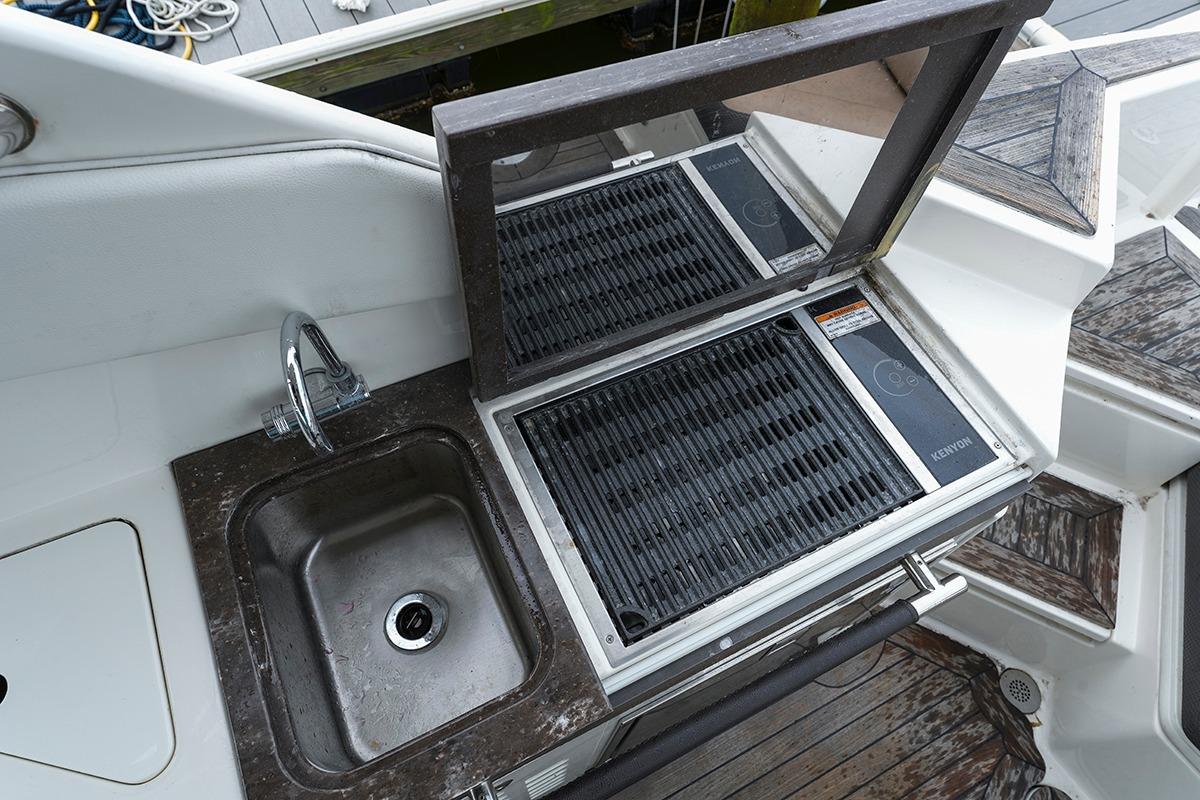 Outdoor sink and grill on 2018 Sea Ray SLX 350 boat deck.