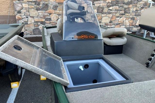 2026 Tracker Bass Tracker Classic Limited boat with open storage compartment and seating.
