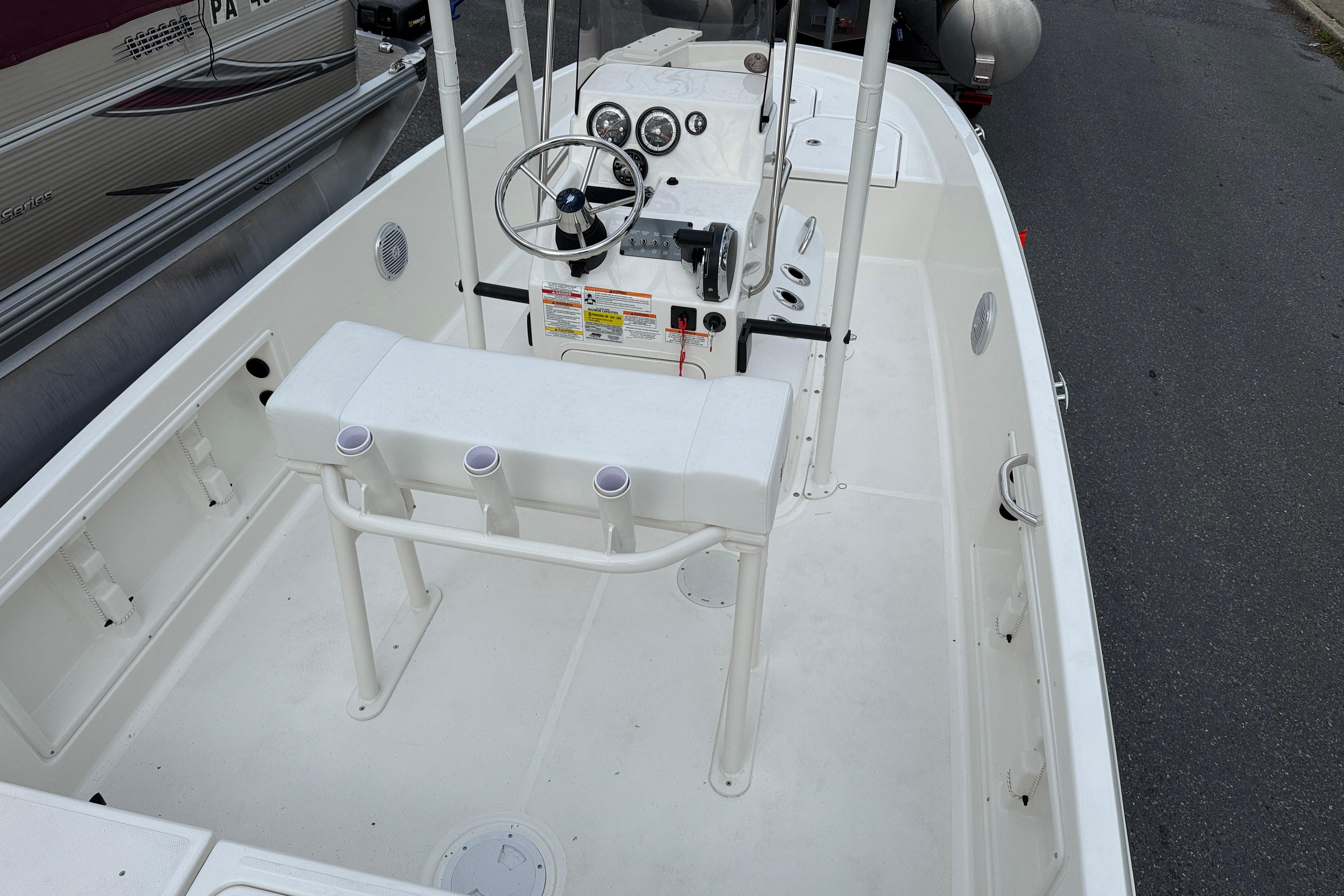 2026 Bayliner Trophy T18 boat interior with steering console and seating.