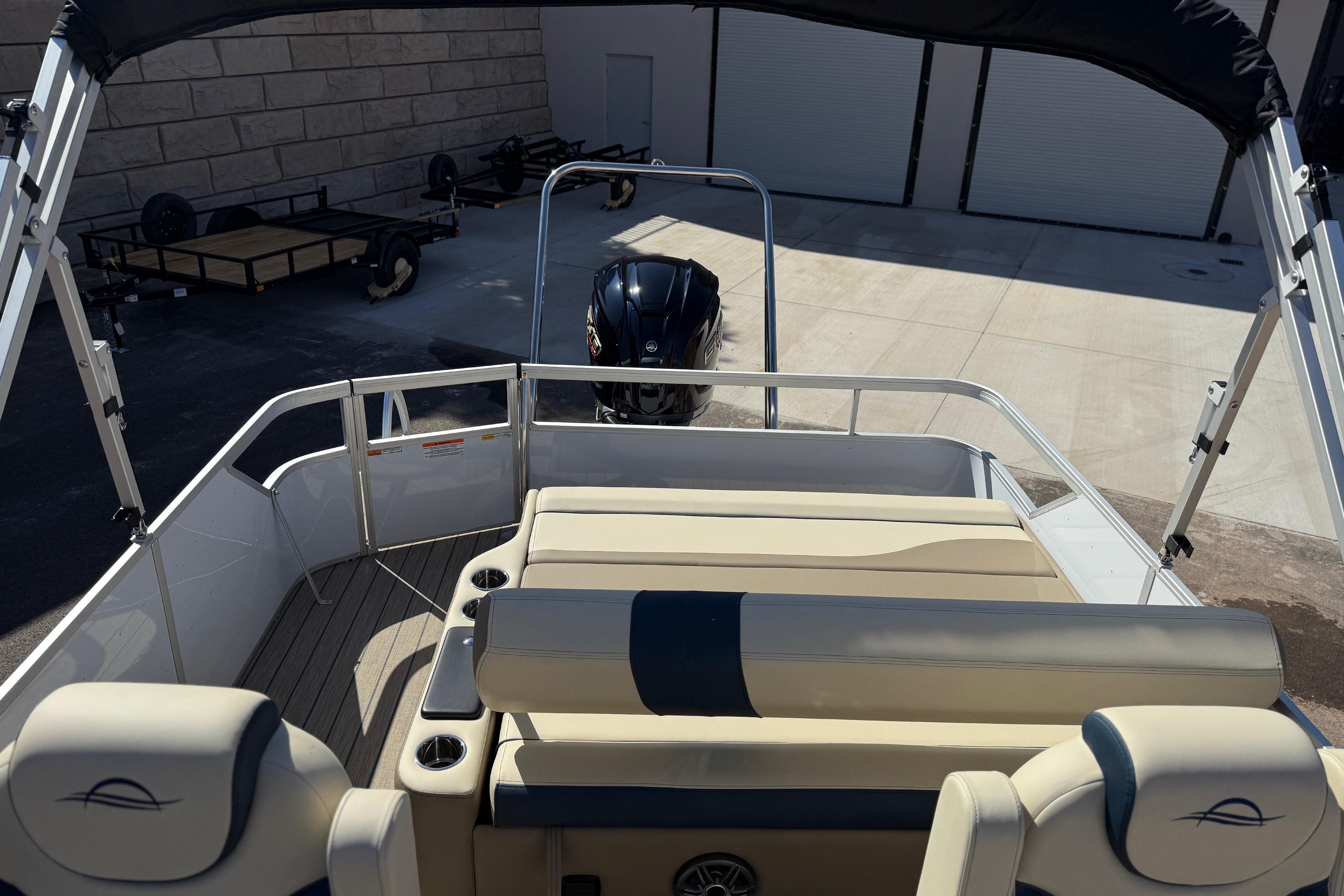 2026 SunCatcher Select 322SL pontoon boat with beige seating and black canopy.