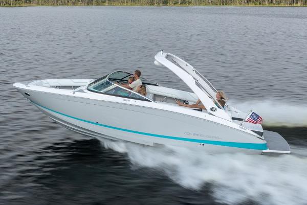 Manufacturer Provided Image: 2026 Regal LS6 boat cruising on a lake with passengers enjoying the ride.
