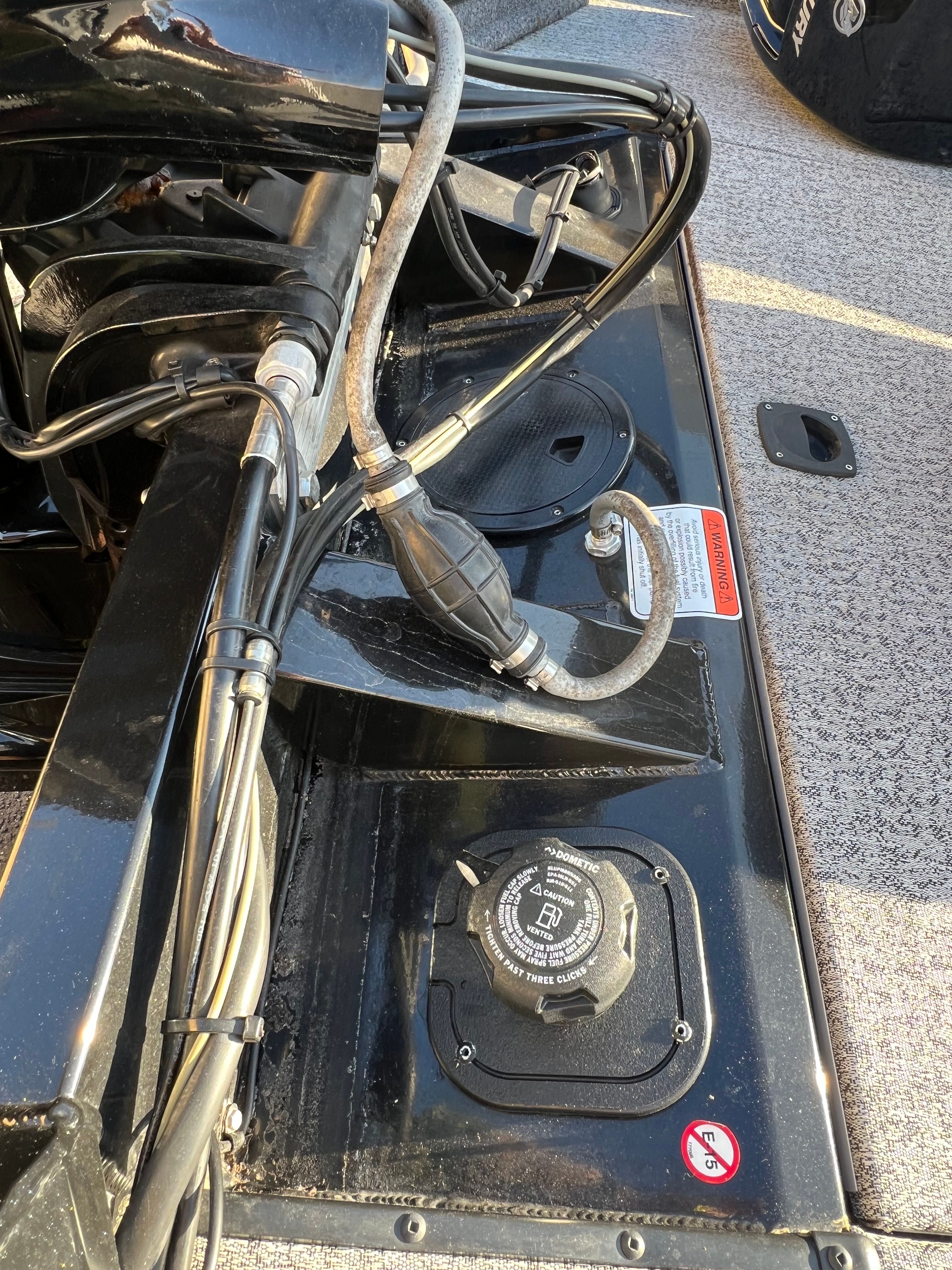 Tracker PRO 2023 boat engine and fuel system close-up.