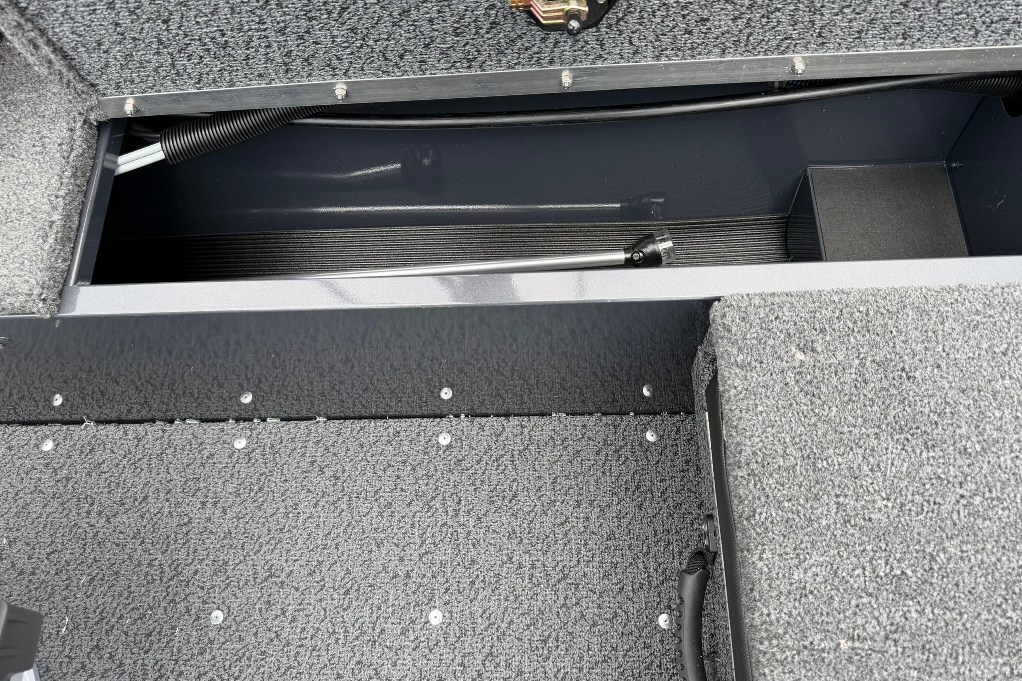 Interior view of 2027 Lund 1675 Adventure Sport boat storage compartment.