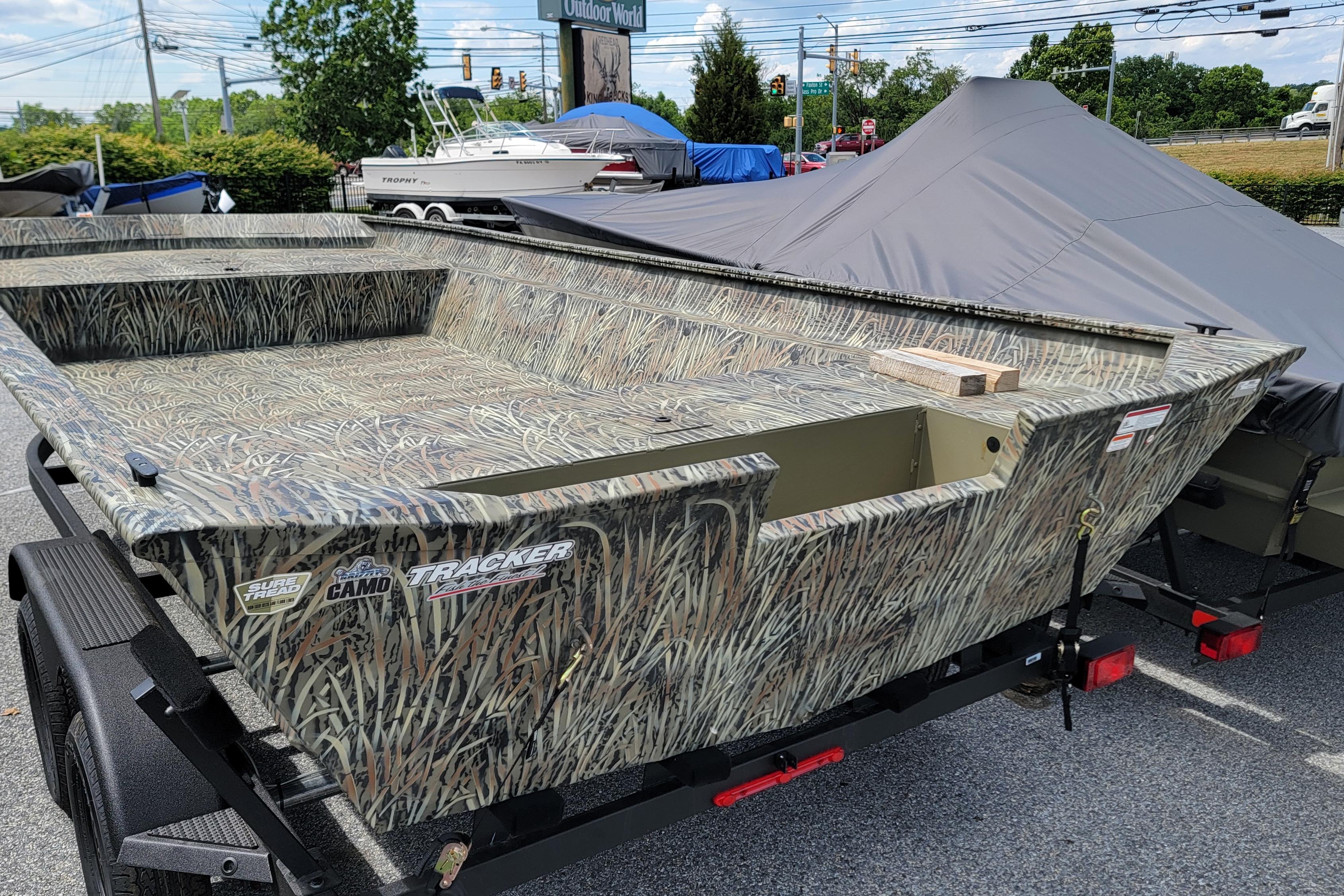 2026 Tracker Grizzly 2072 Utility boat with camo design on a trailer.