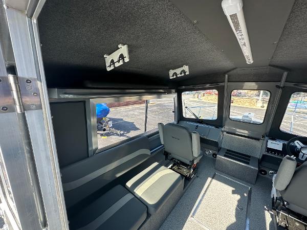 Interior of 2024 Spartan 260 Maximus Pro XL boat with seating and control area.
