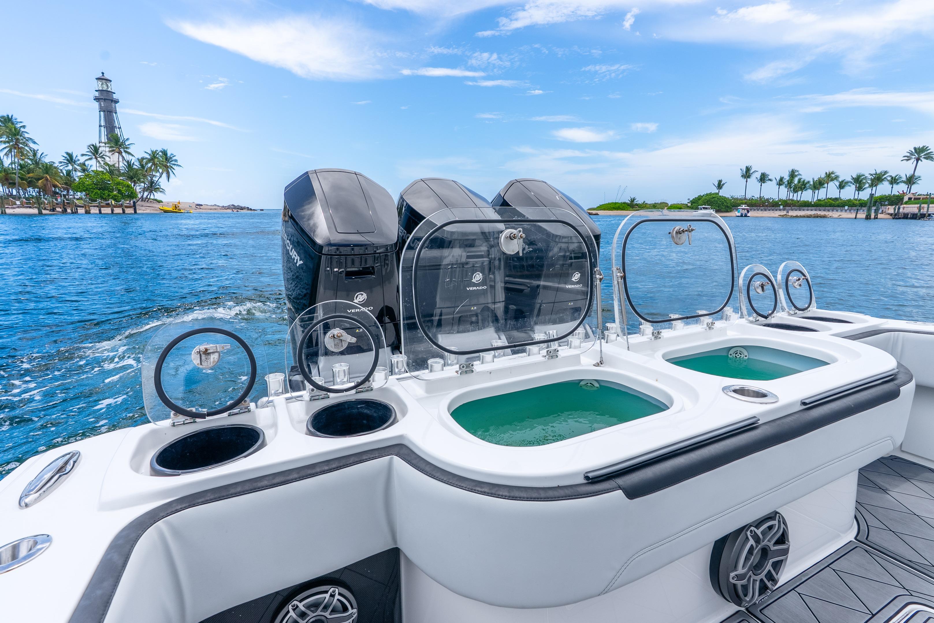 2024 Nor-Tech 452 Super Fish boat with powerful engines and fishing amenities on a scenic waterway.