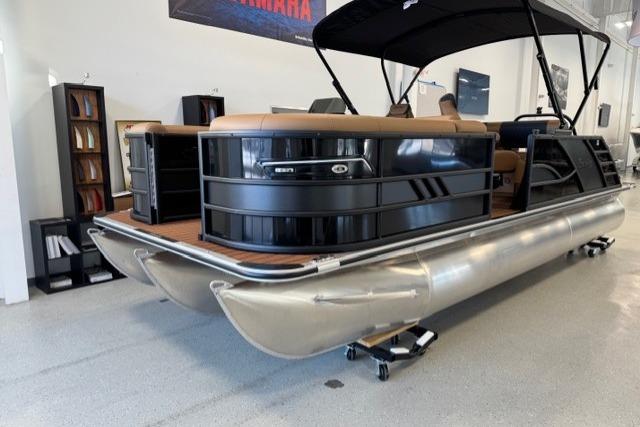 2026 Bentley Pontoons Elite 223 Swingback in showroom, featuring sleek design and modern amenities.