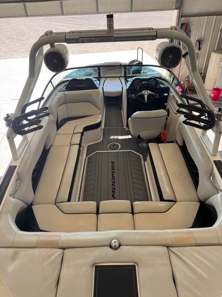 Interior view of a 2015 Moomba Mojo with white seating and modern design.