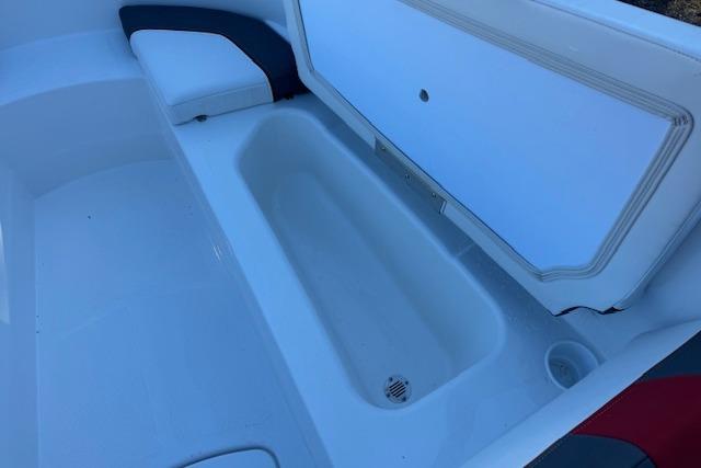 2026 Tahoe T16 boat interior with open storage compartment and seating.