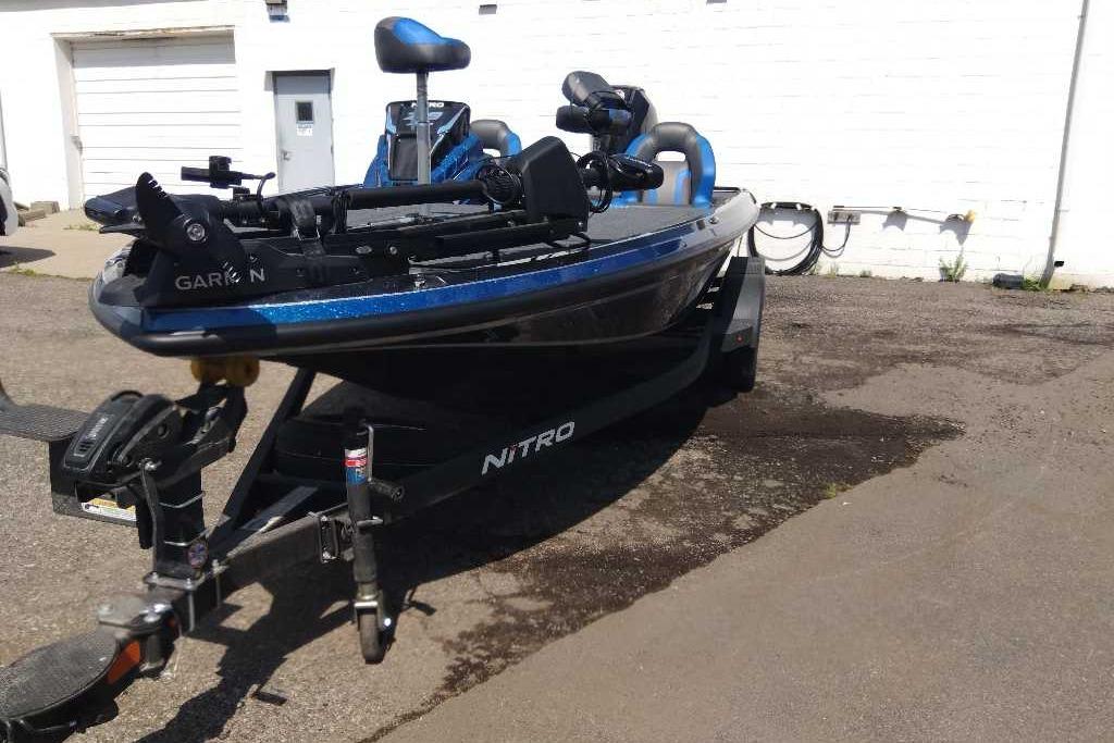 2026 Nitro Z19 XL Pro fishing boat on trailer, parked outdoors.
