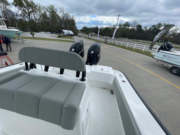 2026 Cape Horn 24XS boat with dual engines, parked outdoors on a cloudy day.