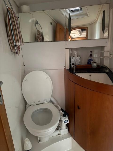 Bathroom interior of 2003 Wauquiez Centurion 45s yacht with toilet and sink.