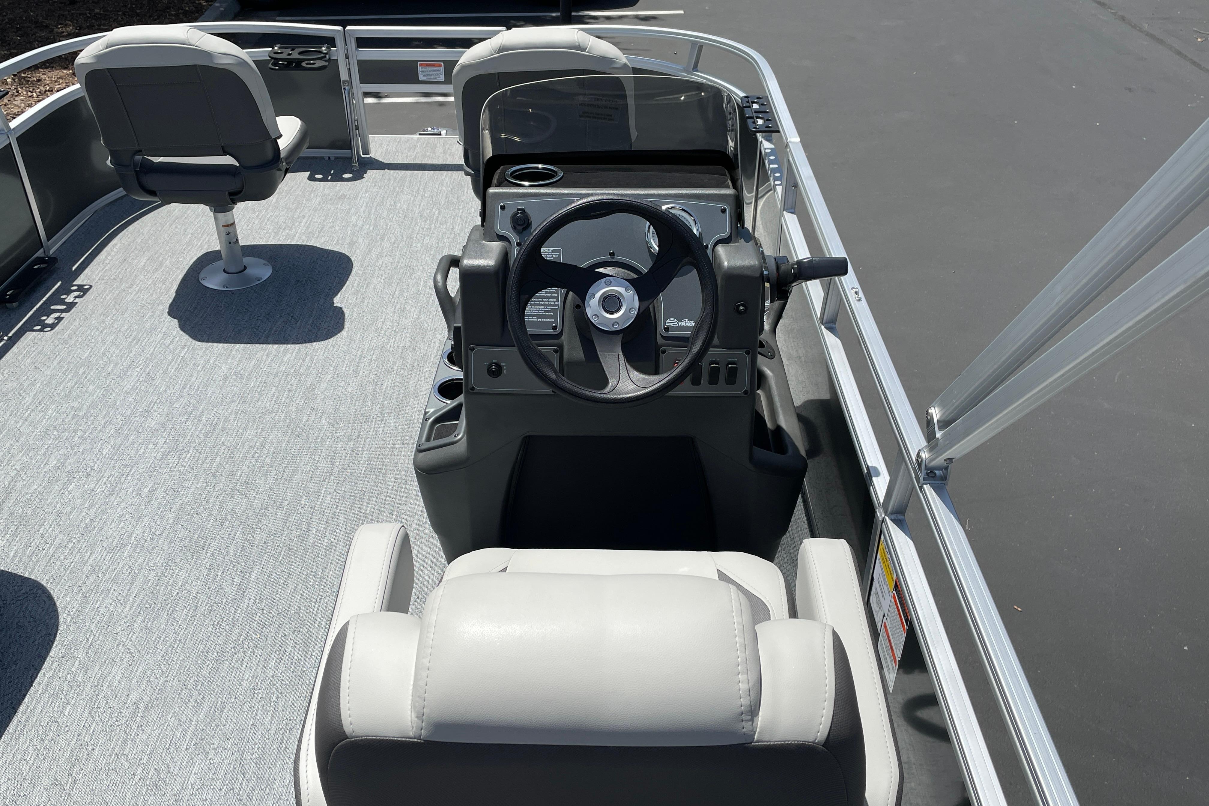2026 Sun Tracker Bass Buggy 16 XL Select boat interior with steering console and seating.