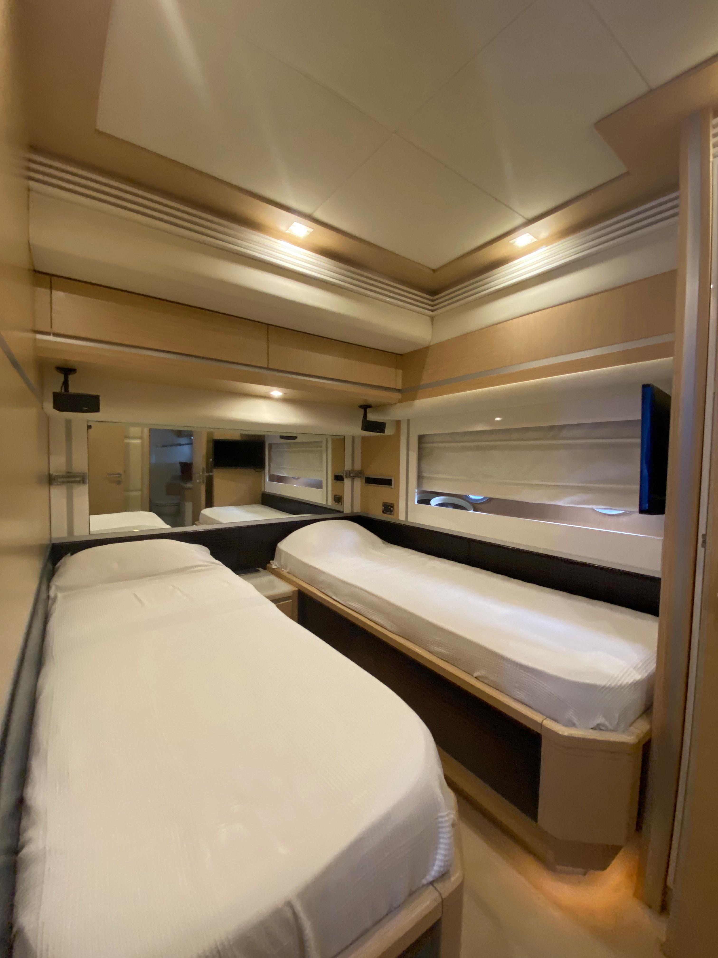 Luxurious interior of 2008 Dominator 680 yacht with twin beds and modern design.
