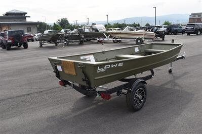 2025 Lowe L1240 Jon boat on trailer in parking lot.