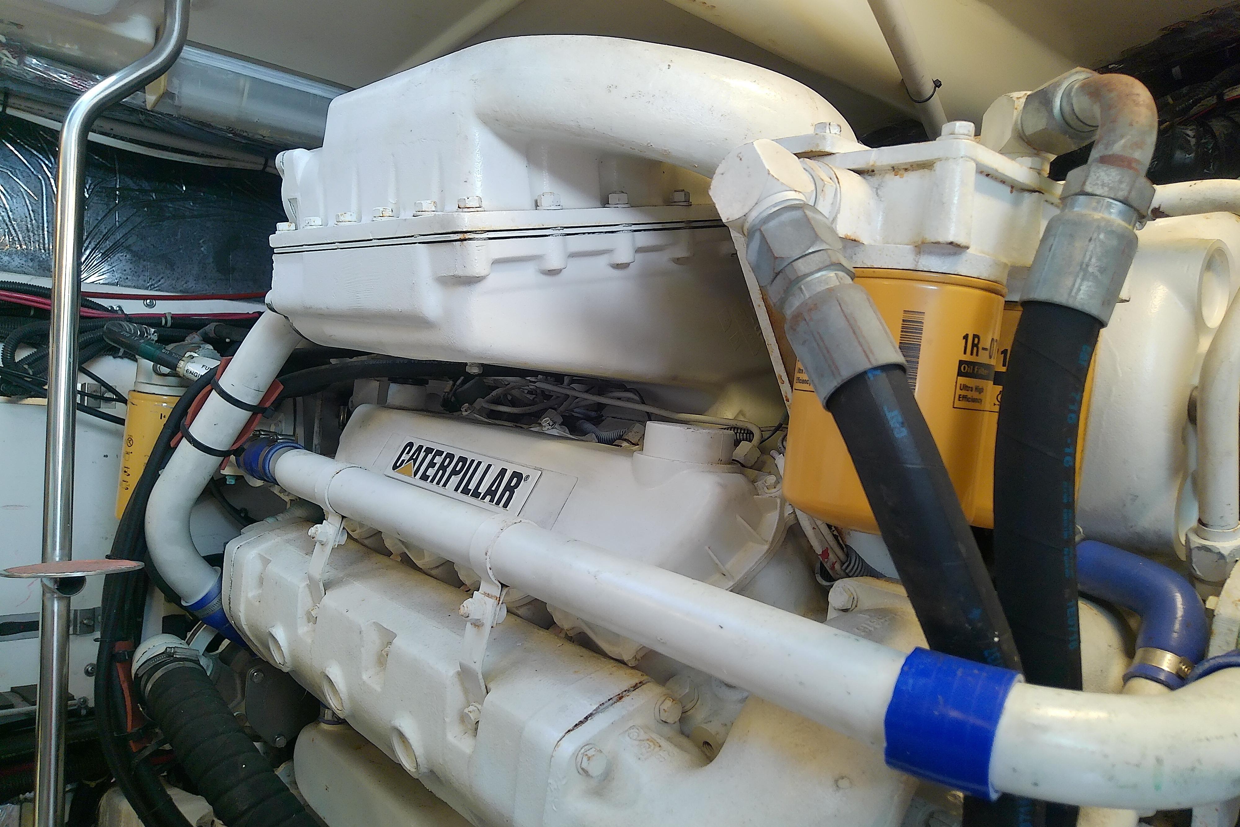 Engine room of 2000 Tiara Yachts 4100 Open with Caterpillar engine components.