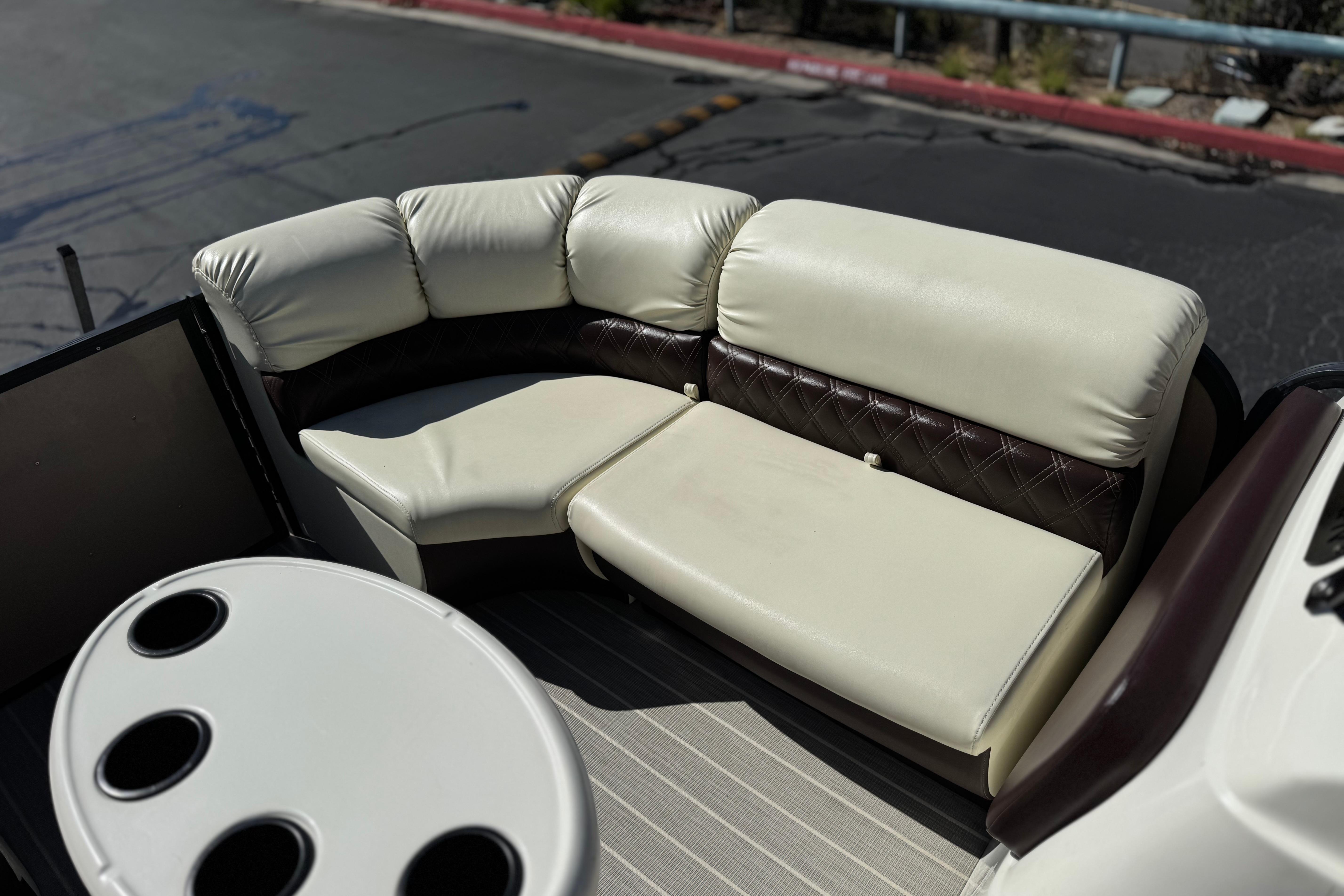 2023 Lexington 623 ST Xtreme boat interior with plush seating and cup holders.
