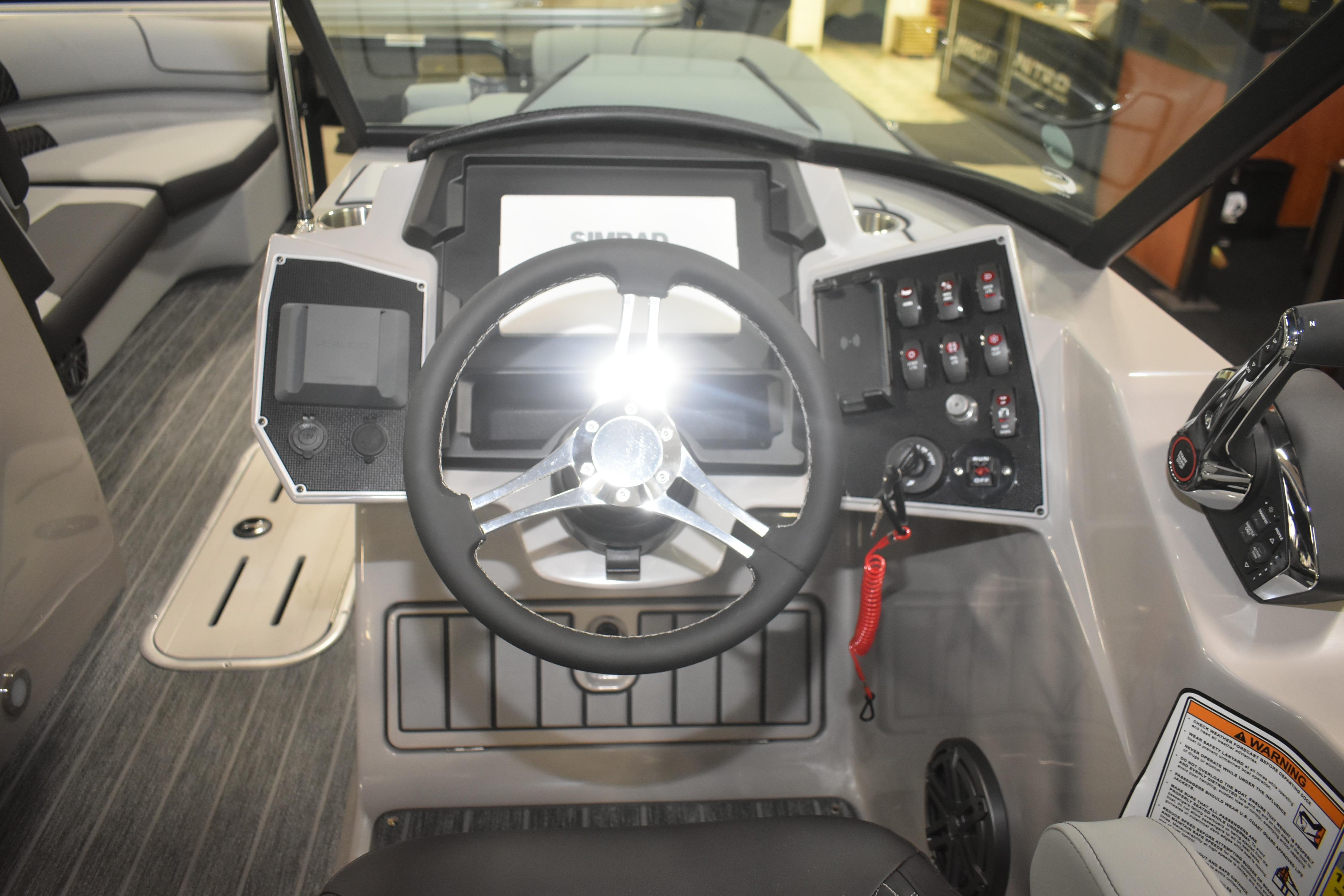 Cockpit of 2026 Premier 250 Solaris Sport boat with modern steering and controls.