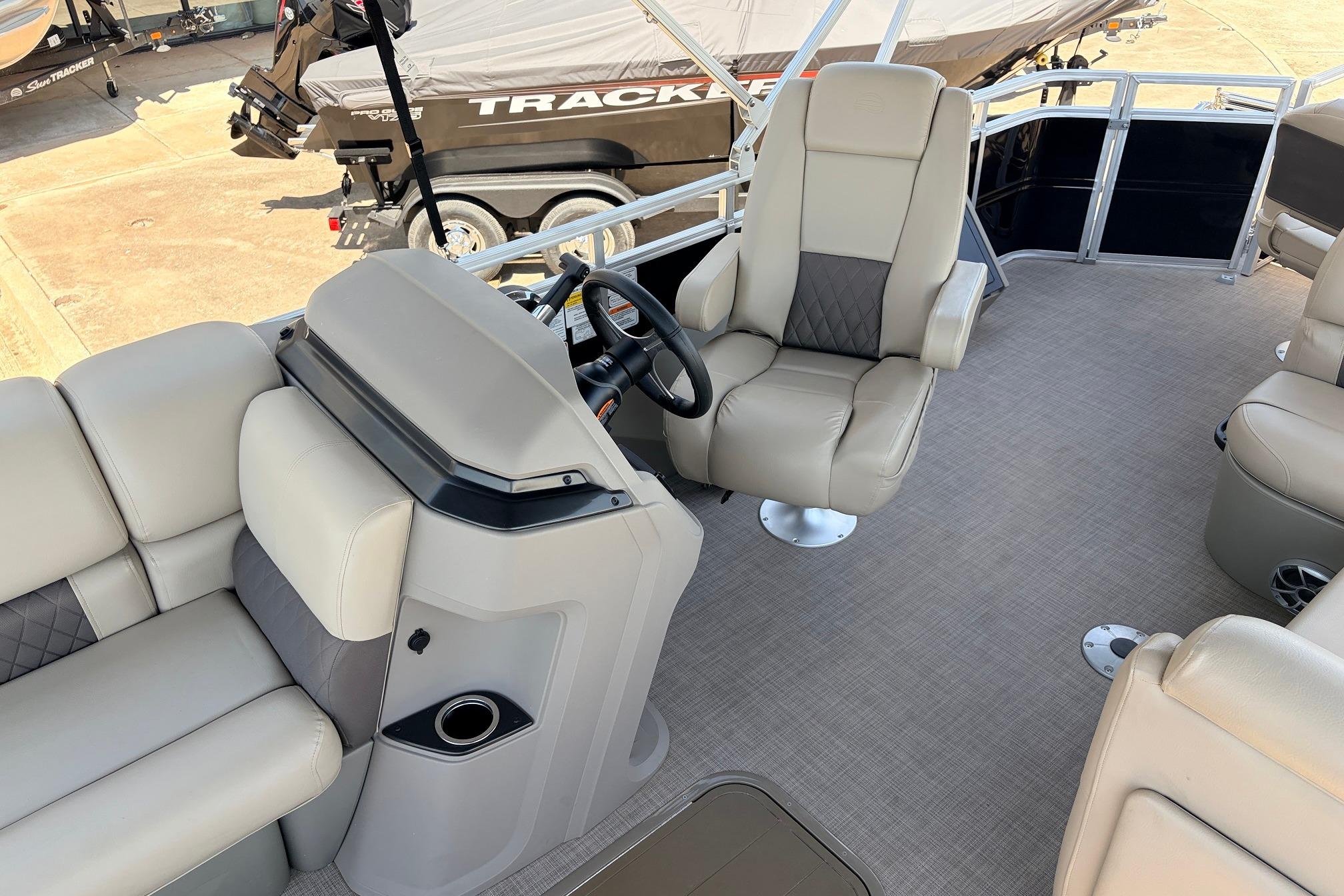 2024 Sun Tracker SportFish 22 XP3 interior with plush seating and modern helm design.