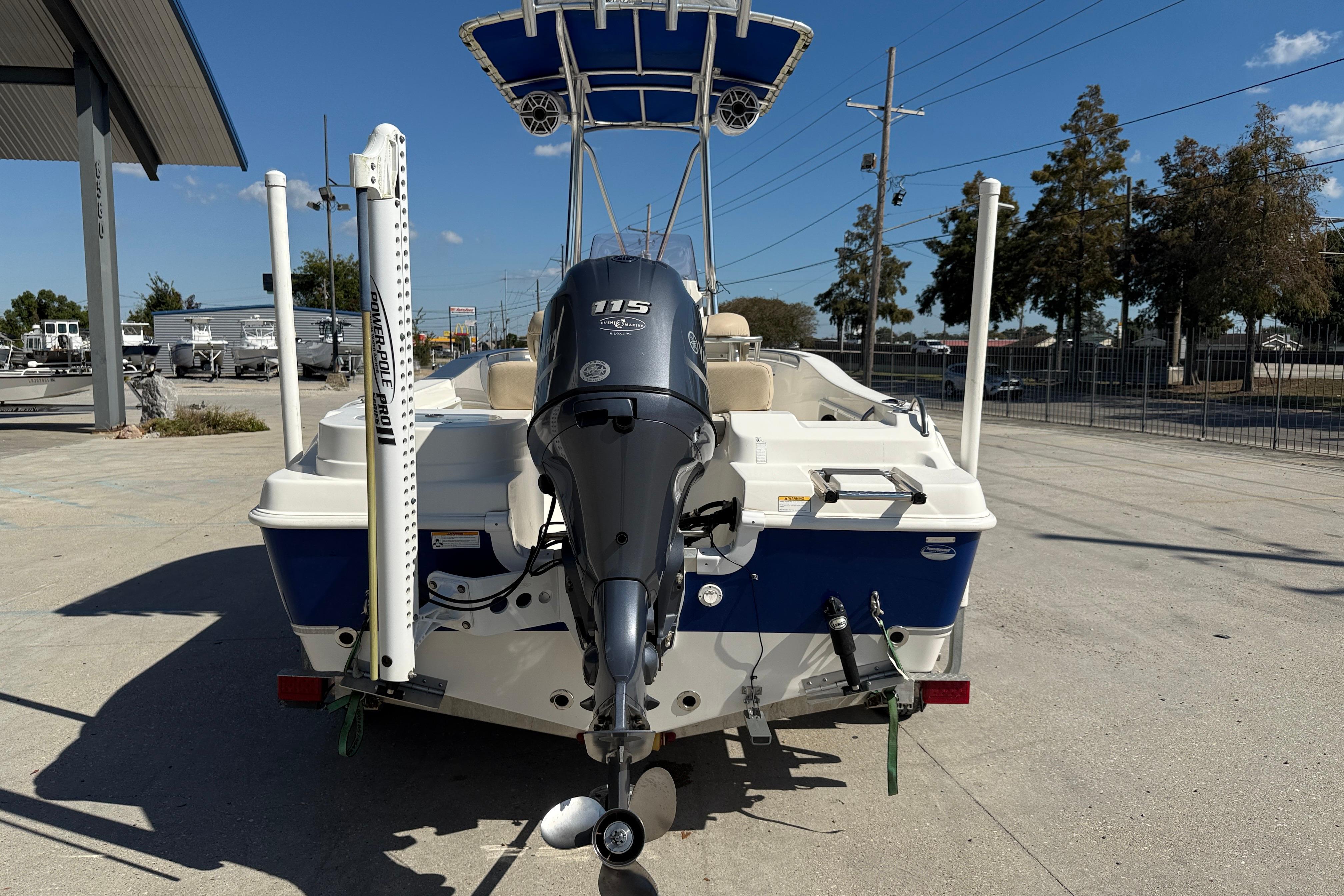 2019 NauticStar 19 XS boat with Yamaha 115 engine, parked outdoors.
