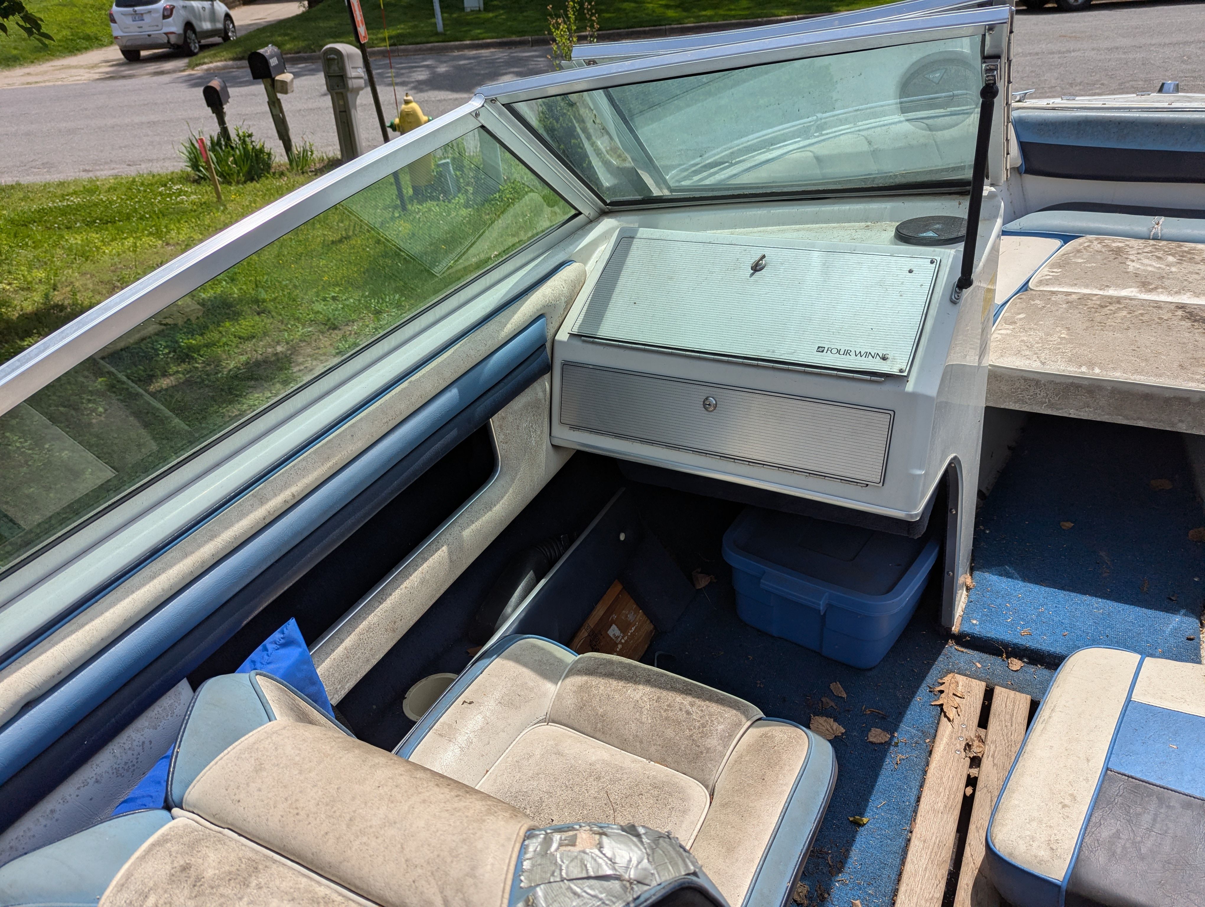 Interior of a 1988 Four Winns 200 Horizon boat with blue seats.