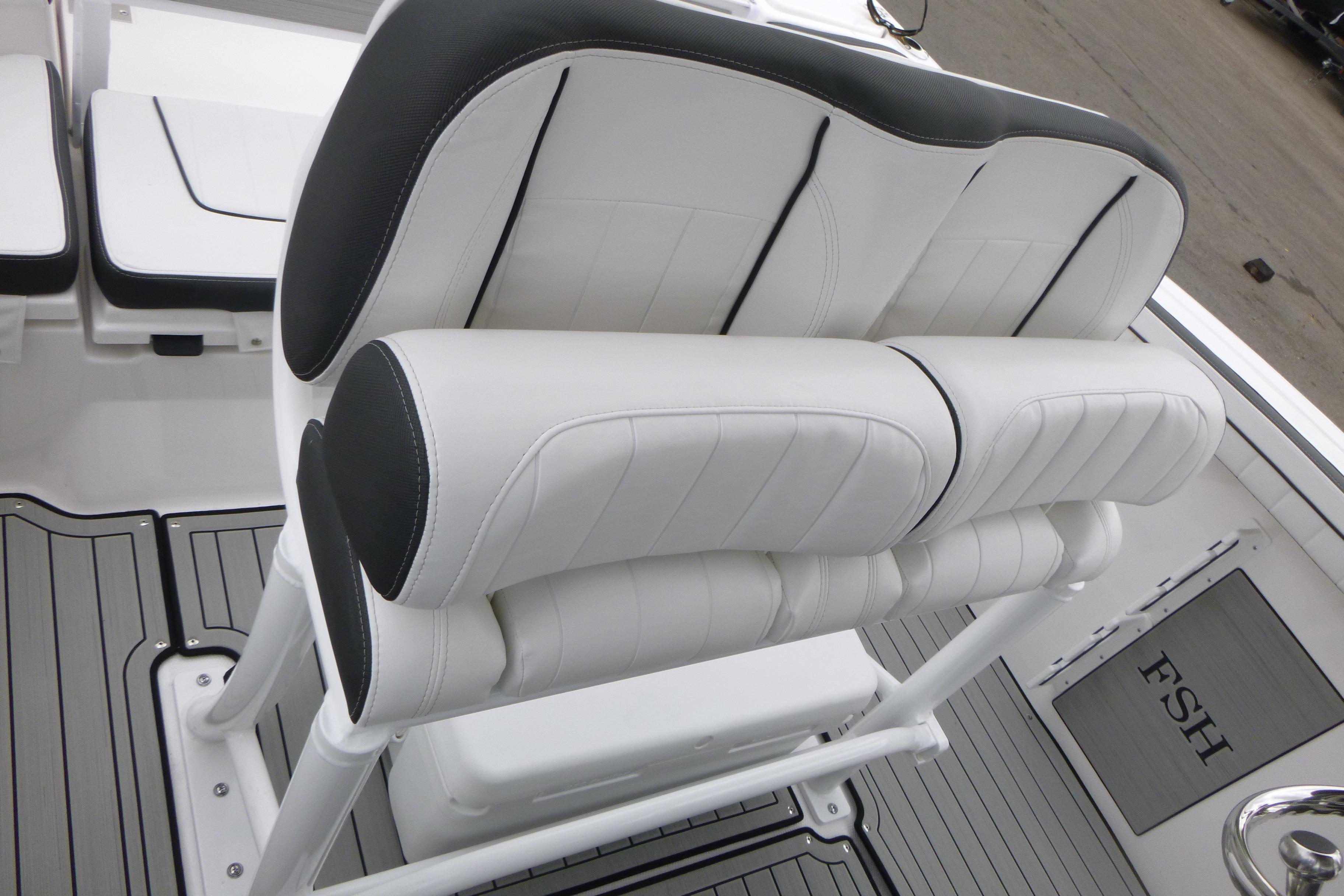 2026 Yamaha Boats 255 FSH Sport H interior seating, featuring sleek white and black upholstery.