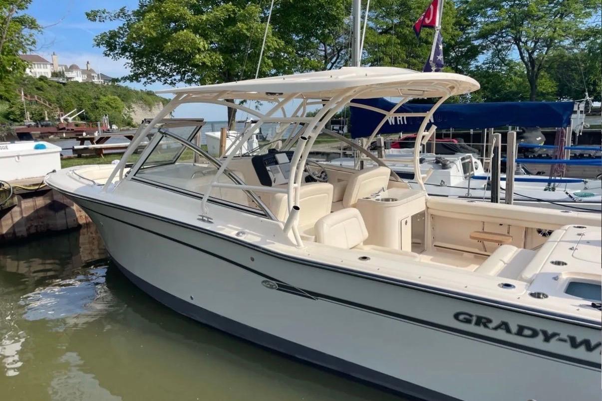 2019 Grady-White Freedom 307 boat docked in a scenic marina setting.