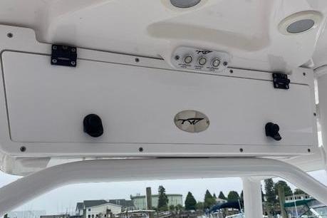 2020 Tidewater 220 CC boat console with storage compartment and control panel.