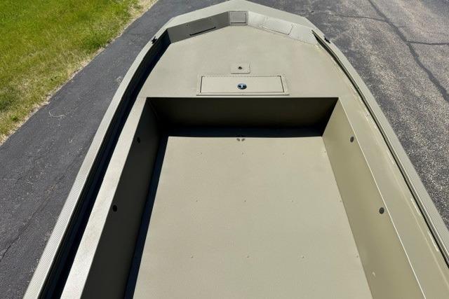 2026 Tracker Grizzly 1754 Utility boat interior, showcasing spacious deck and storage compartment.