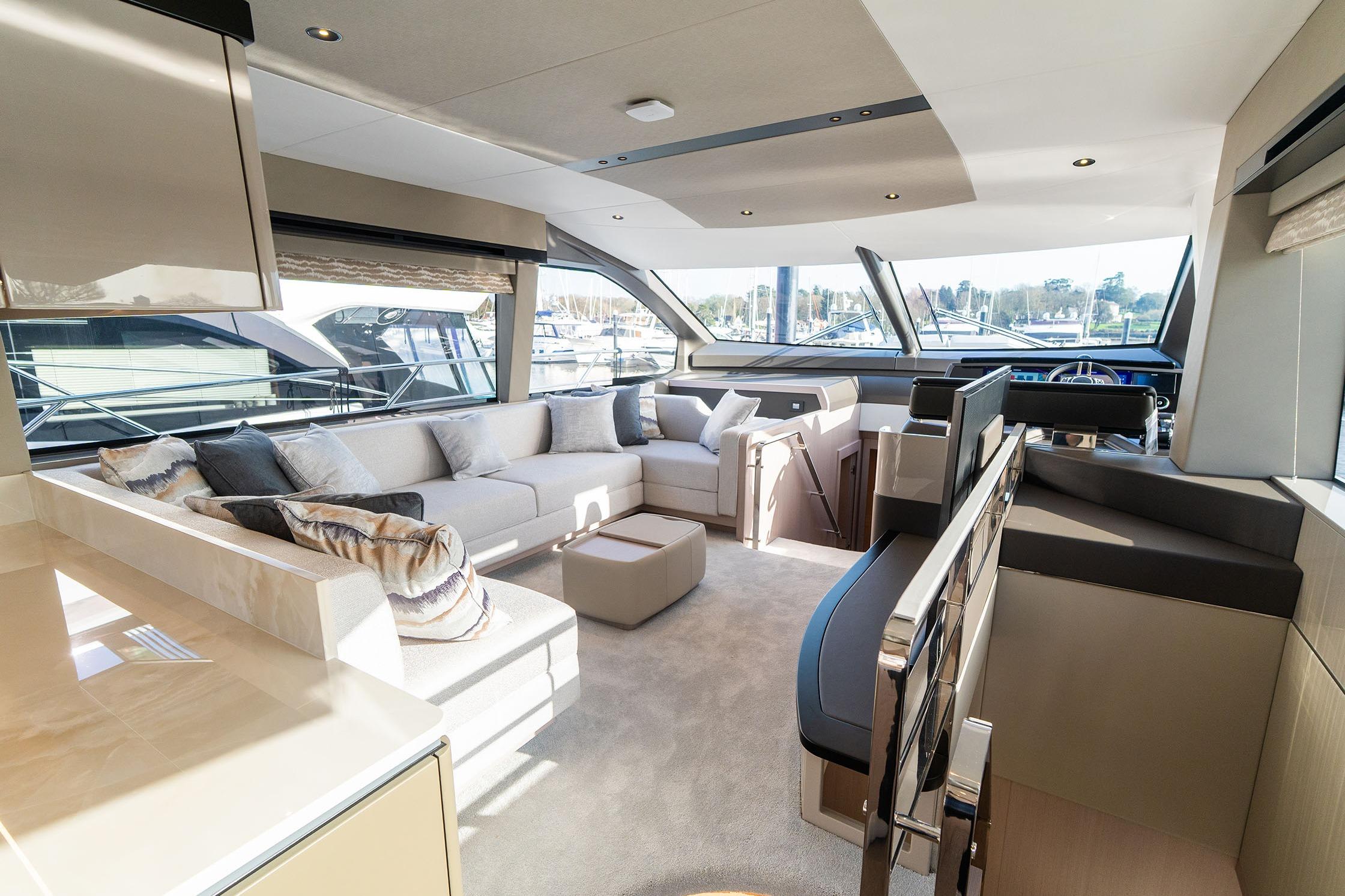 Luxurious interior of 2026 Sunseeker Manhattan 68 yacht with modern furnishings and panoramic windows.